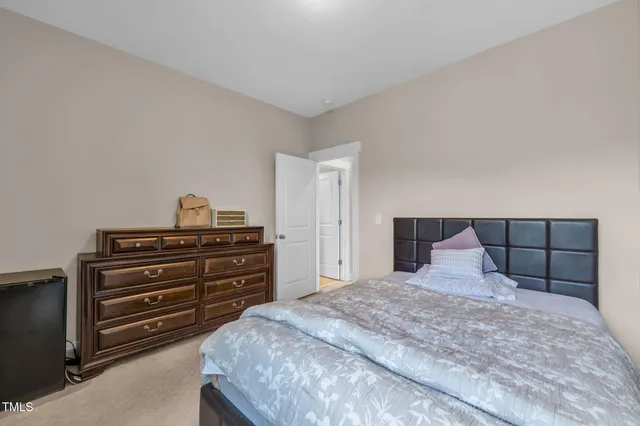 a living room with furniture a flat screen tv and a large window