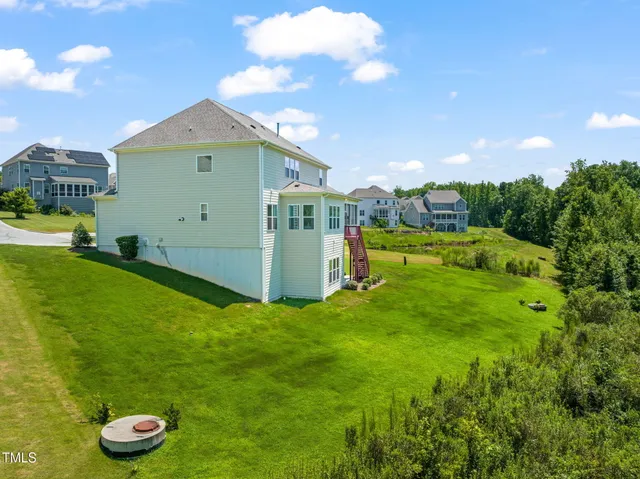 an aerial view of a house with a garden