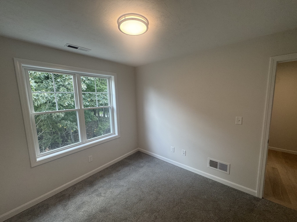 19 Ambrose Way, Unit 19 Shirley, MA 01464 - Photo 12 of 21 an empty room with a window