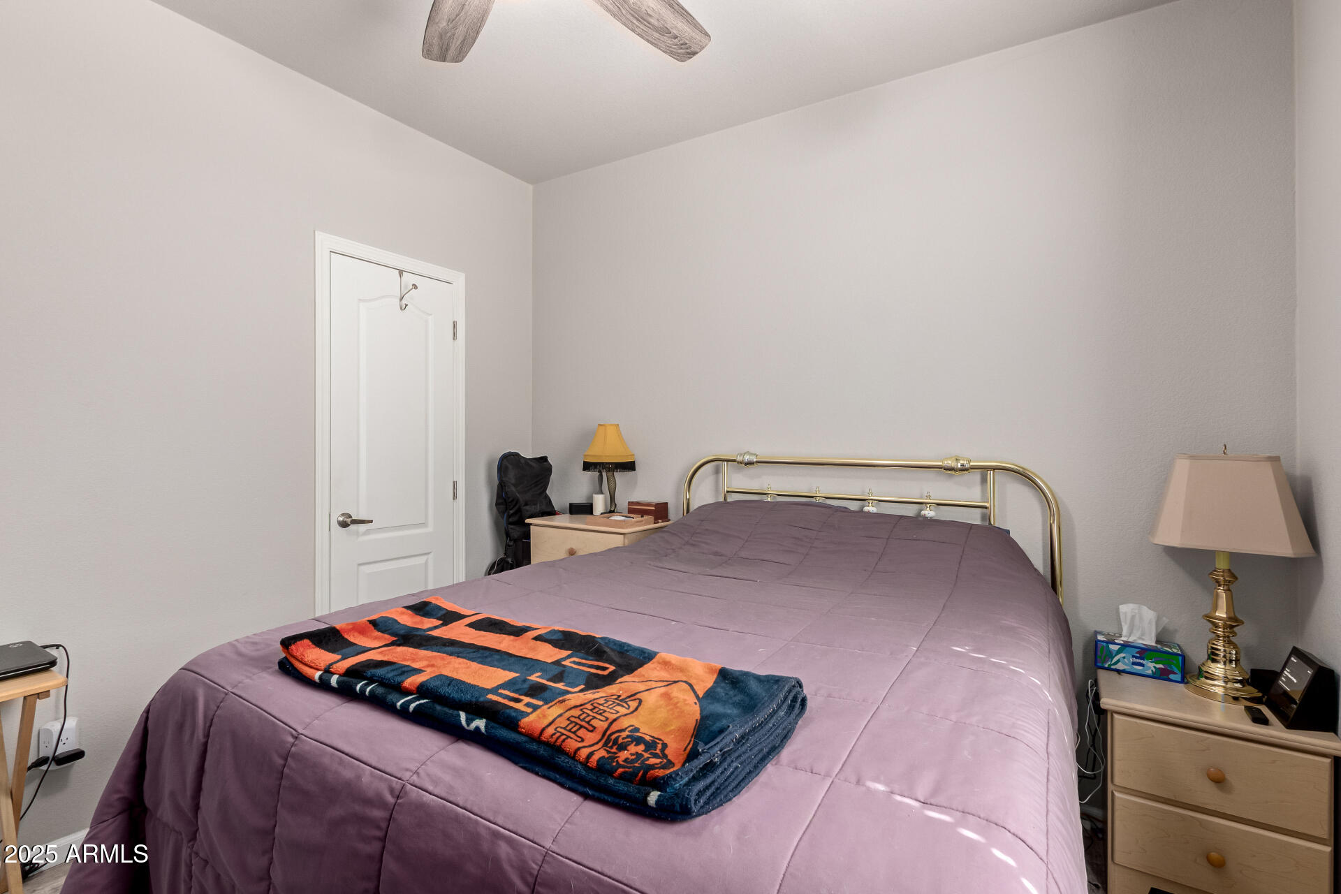 2929 East Main Street, Unit 160 Mesa, AZ 85213 - Photo 18 of 29 a bedroom with bed and a lamp