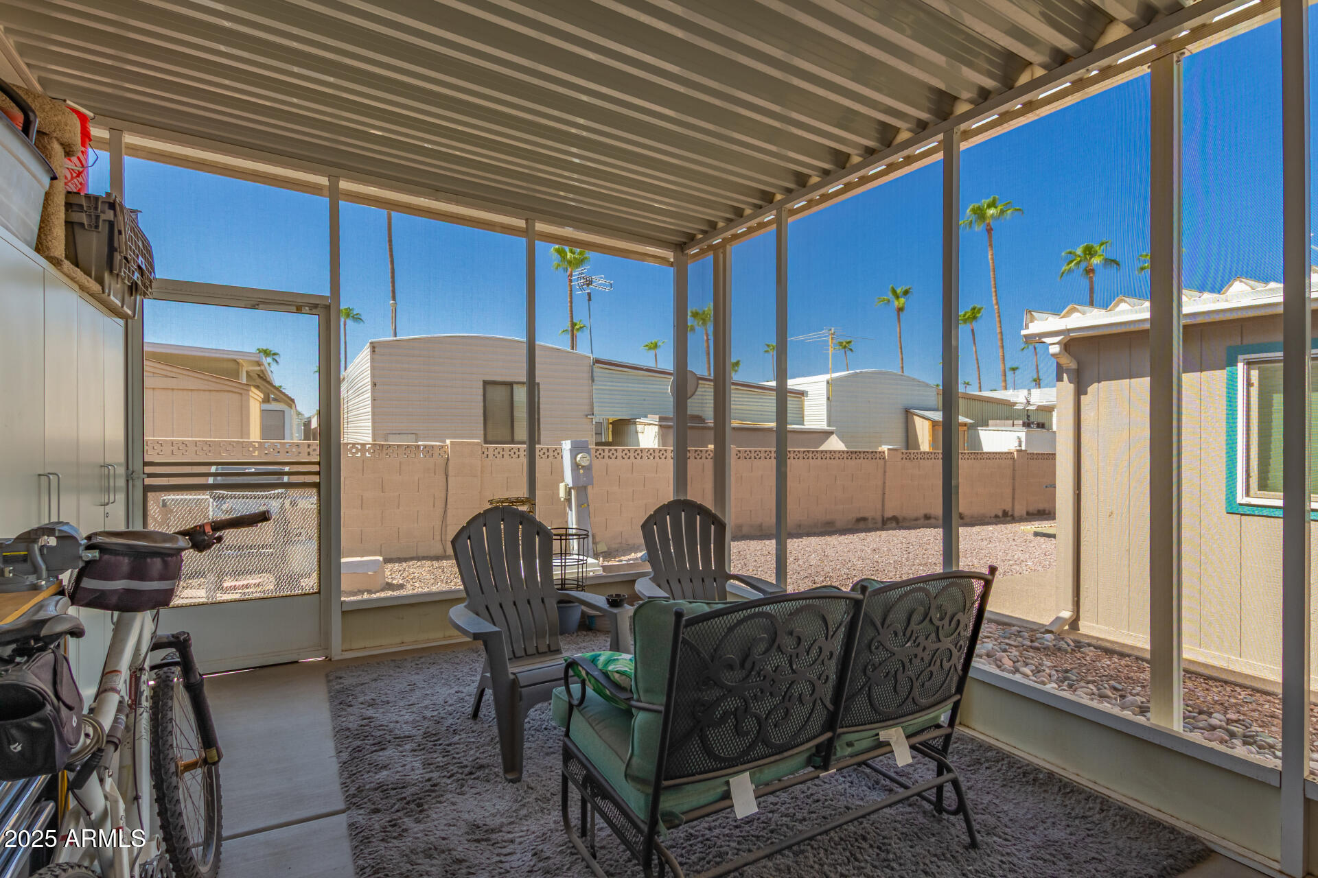 2929 East Main Street, Unit 160 Mesa, AZ 85213 - Photo 23 of 29 a dining room with furniture and a floor to ceiling window