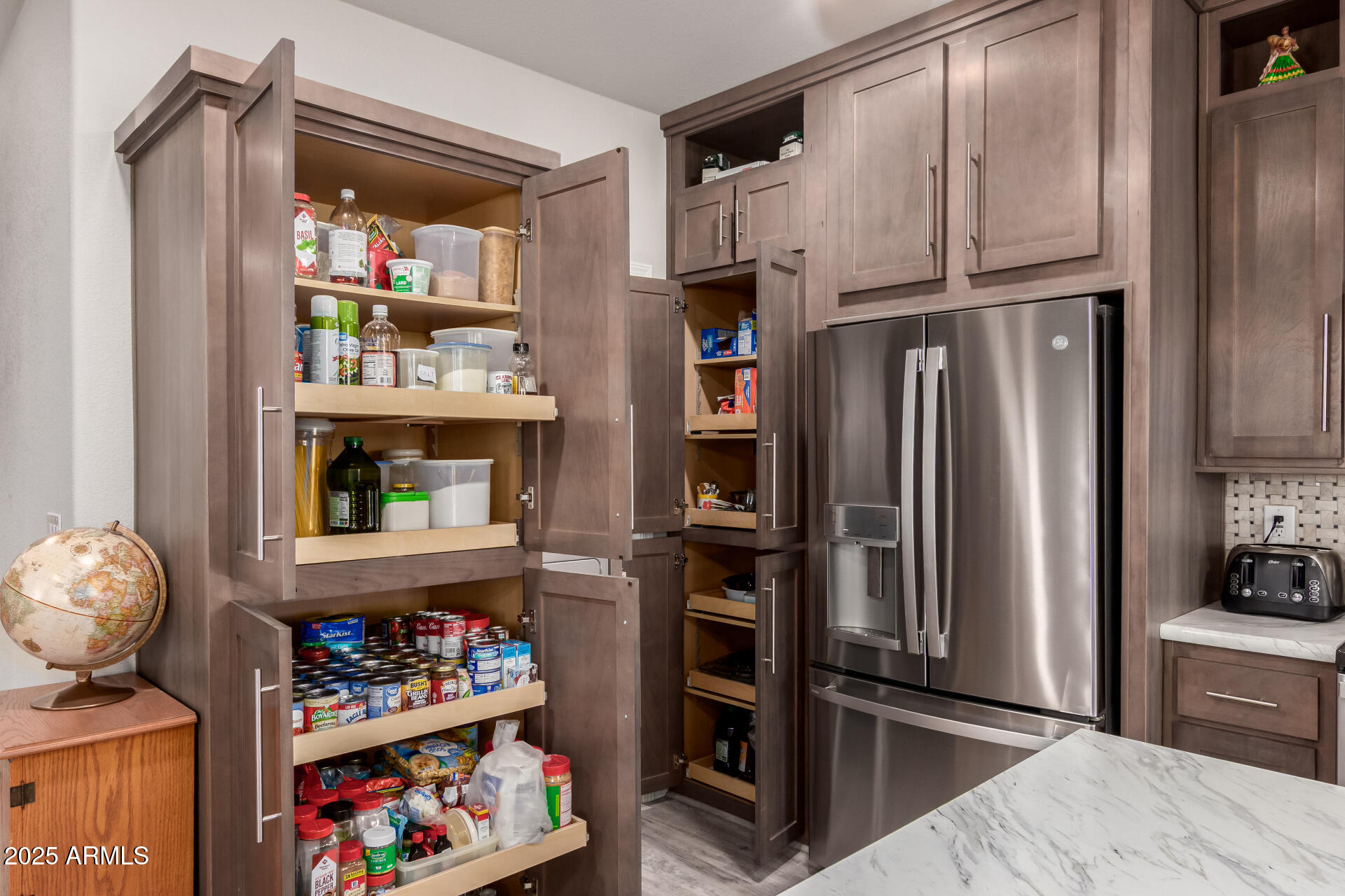 2929 East Main Street, Unit 160 Mesa, AZ 85213 - Photo 6 of 29 a kitchen with stainless steel appliances a refrigerator and a stove top oven