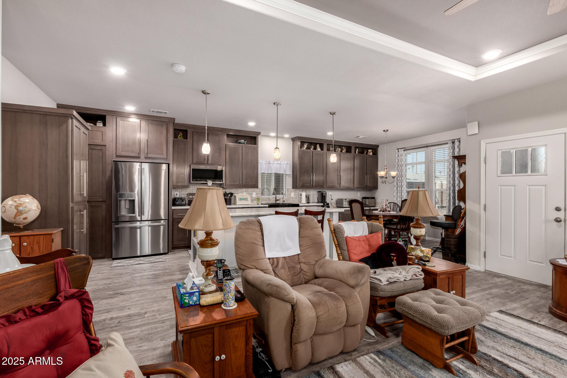 2929 East Main Street, Unit 160 Mesa, AZ 85213 - Photo 9 of 29 a living room with furniture and kitchen view