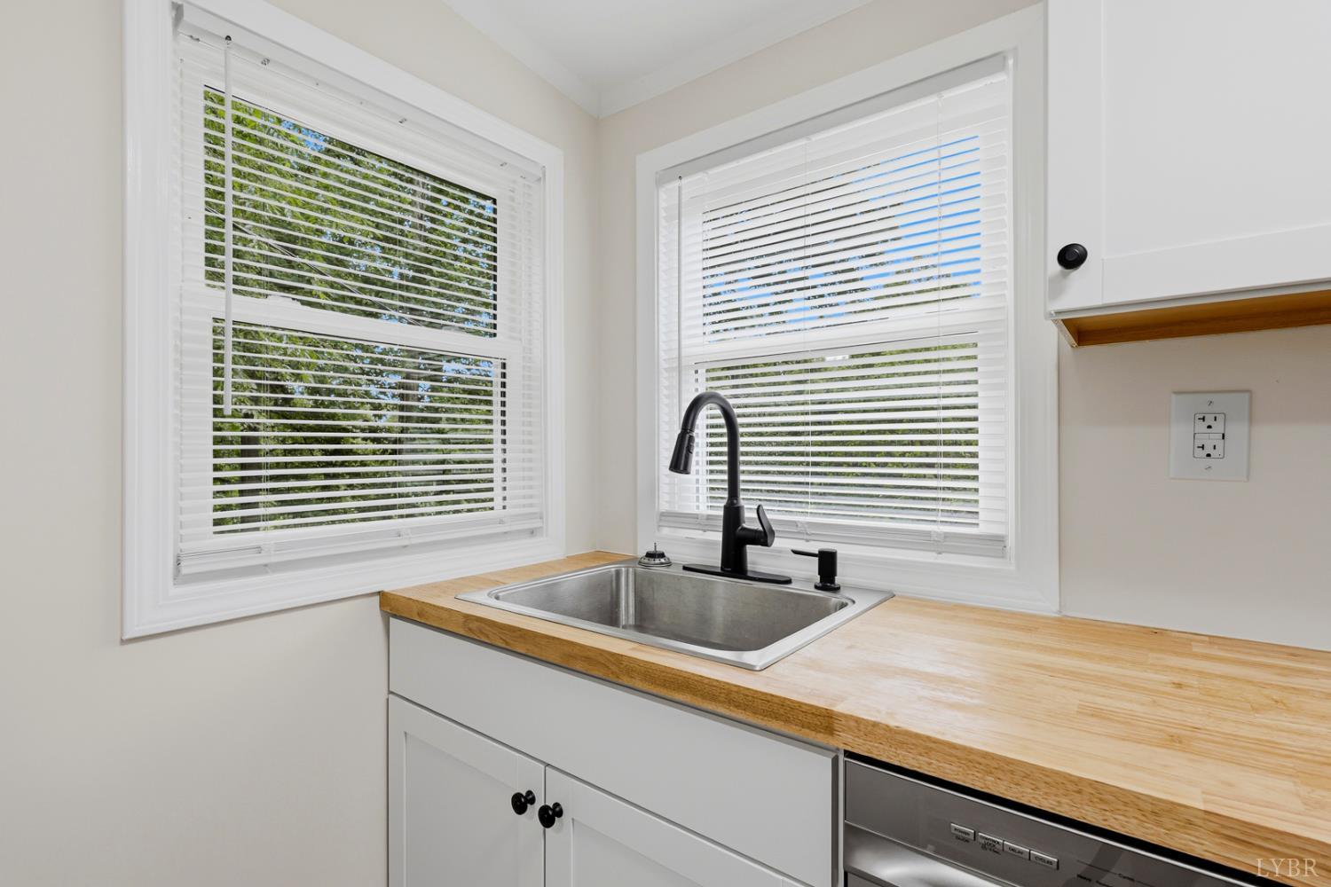 304 Ridgelake Road Goodview, VA 24095 - Photo 9 of 29 a kitchen with a sink and large window