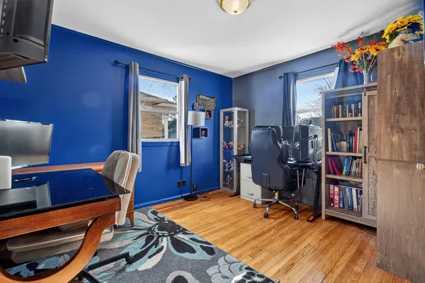 a room with furniture and a book shelf
