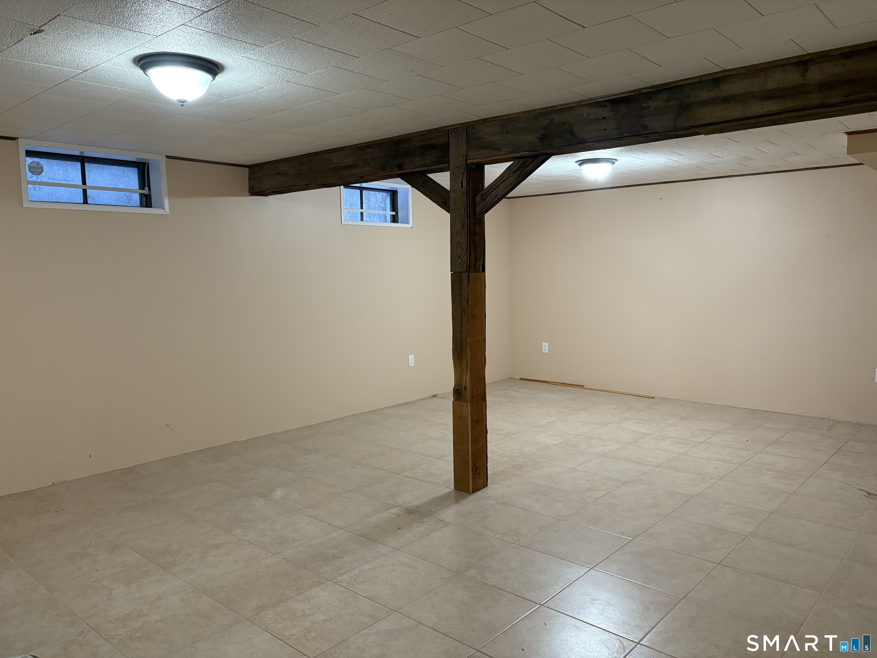 100 North Airline Road Wallingford, CT 06492 - Photo 29 of 40 An easy to care for tile floor is in perfect condition and is perfect for a rec room.