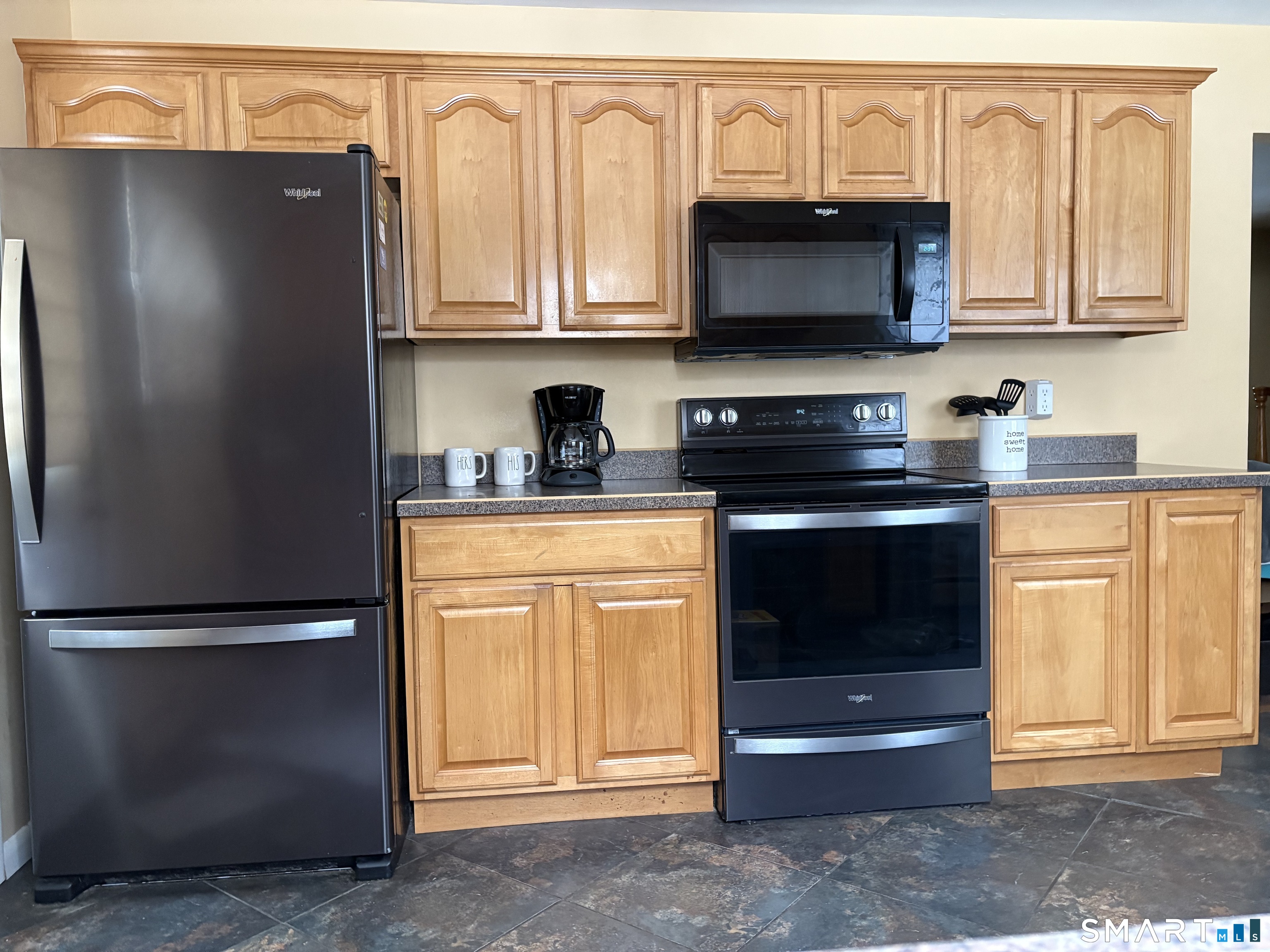 100 North Airline Road Wallingford, CT 06492 - Photo 4 of 40 Two walls of cabinets provide plenty of storage space for all your kitchen storage needs.