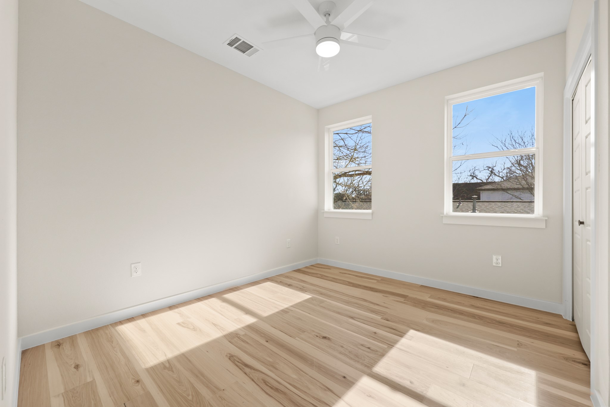 4801 Sara Drive, Unit B Austin, TX 78721 - Photo 31 of 40 a view of empty room with wooden floor