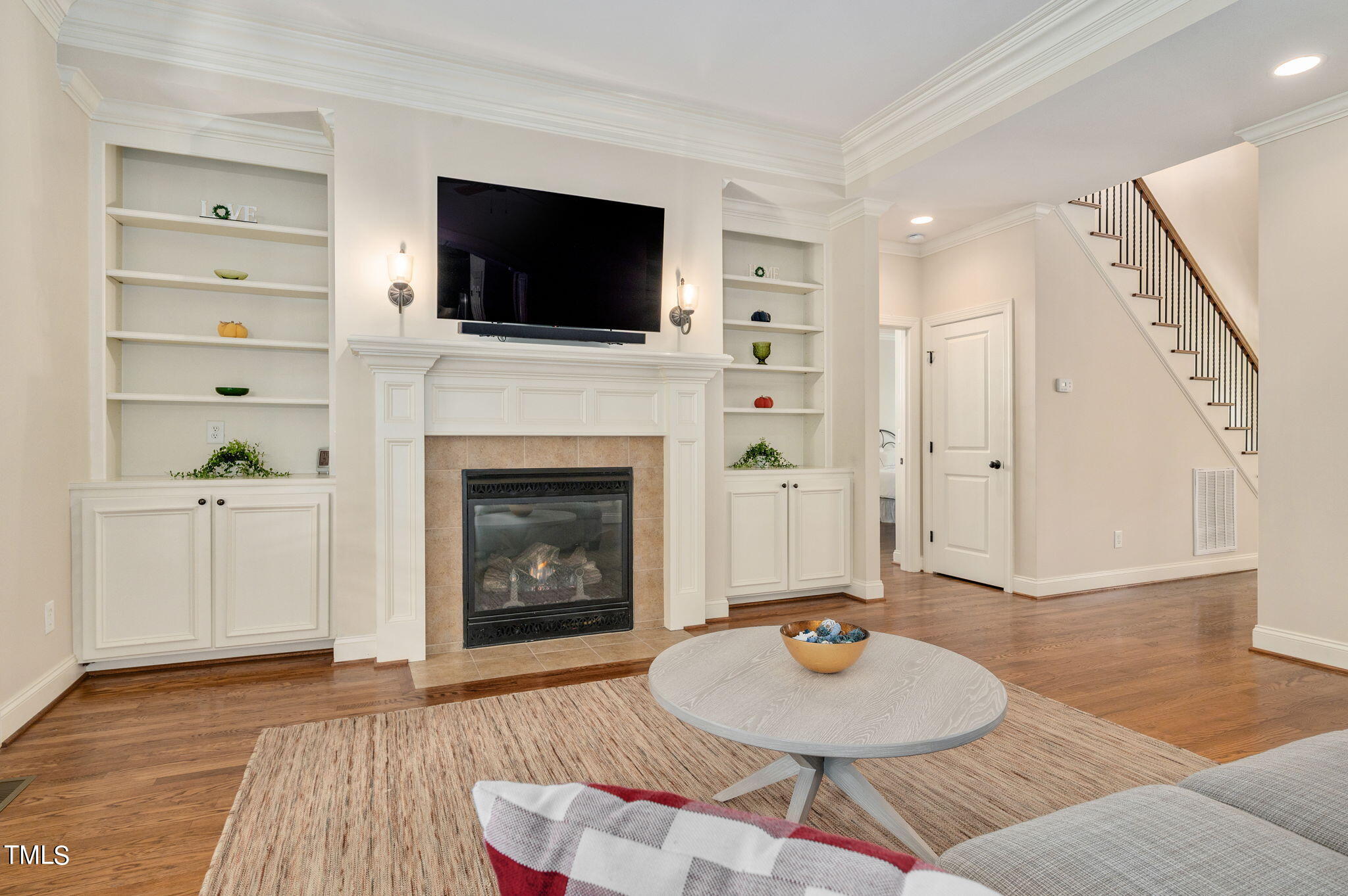 11519 Azari Court Raleigh, NC 27614 - Photo 11 of 55 a living room with furniture a fireplace and a flat screen tv