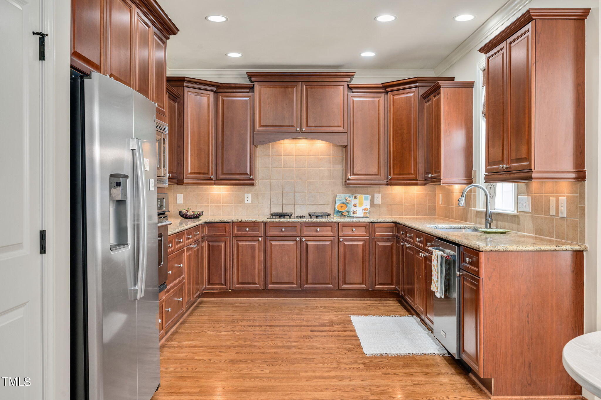 11519 Azari Court Raleigh, NC 27614 - Photo 15 of 55 a kitchen with granite countertop a refrigerator and a sink