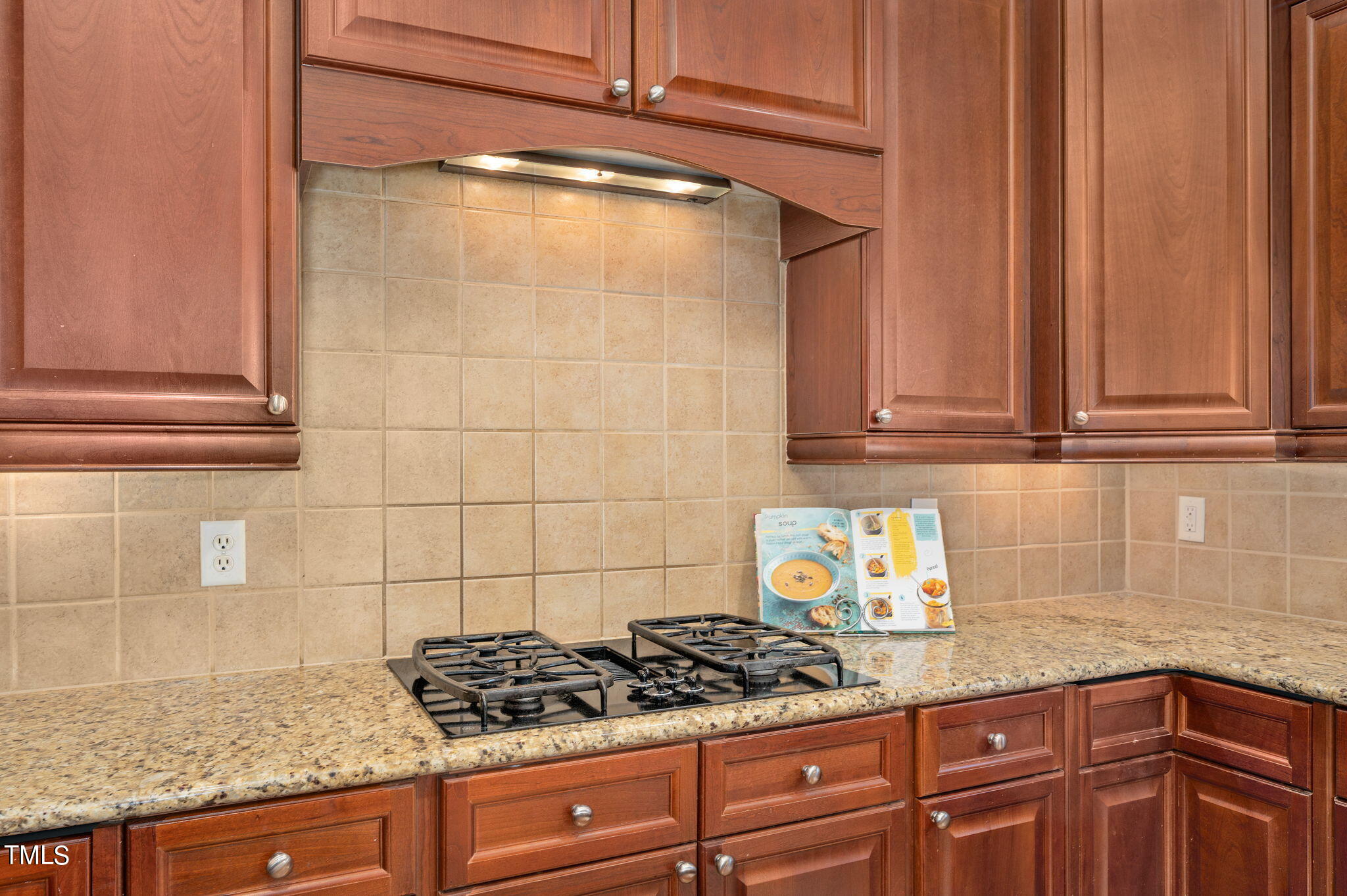11519 Azari Court Raleigh, NC 27614 - Photo 18 of 55 a kitchen with granite countertop a sink and cabinets