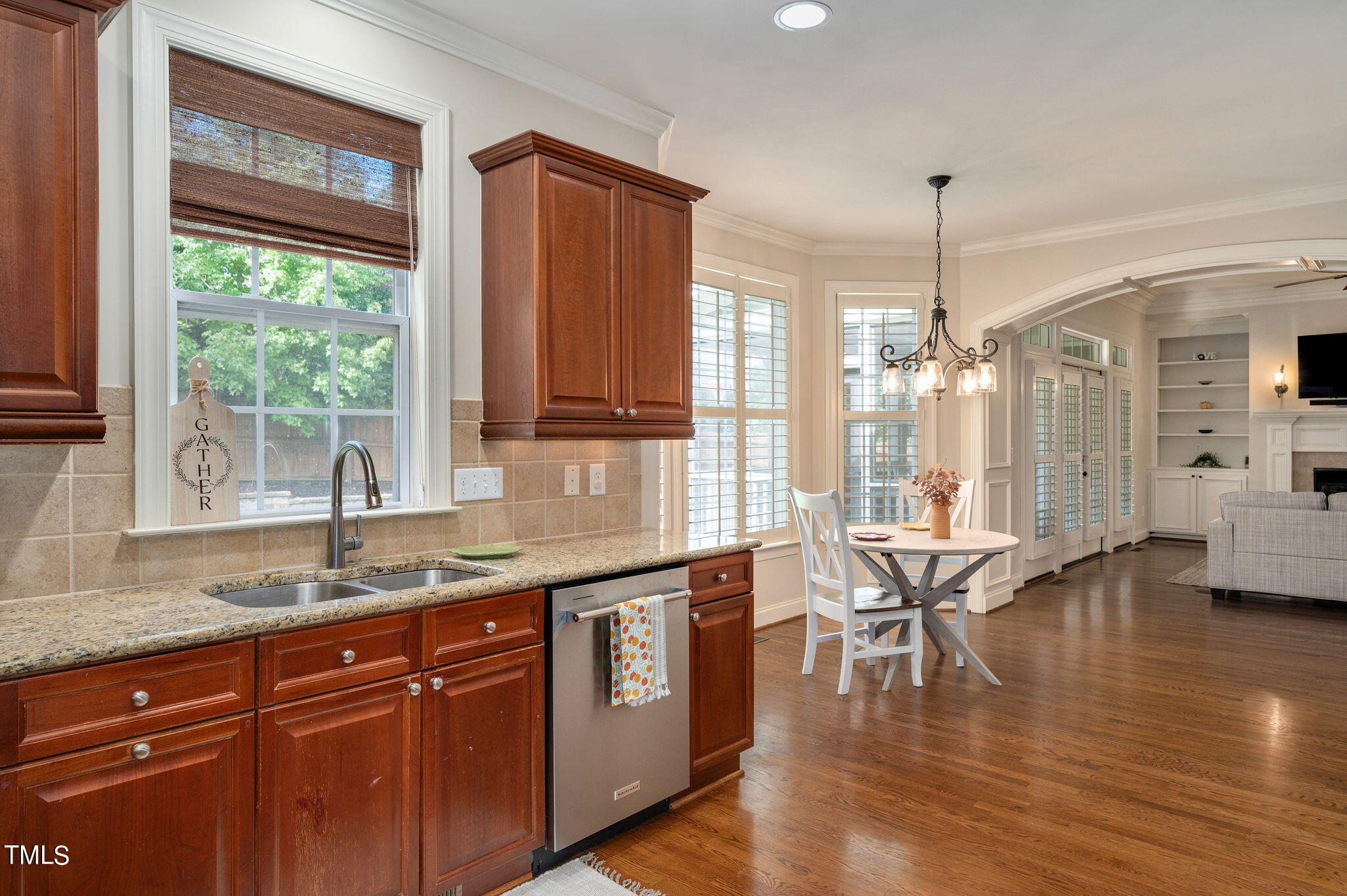 11519 Azari Court Raleigh, NC 27614 - Photo 19 of 55 a kitchen with stainless steel appliances granite countertop wooden floors and white cabinets
