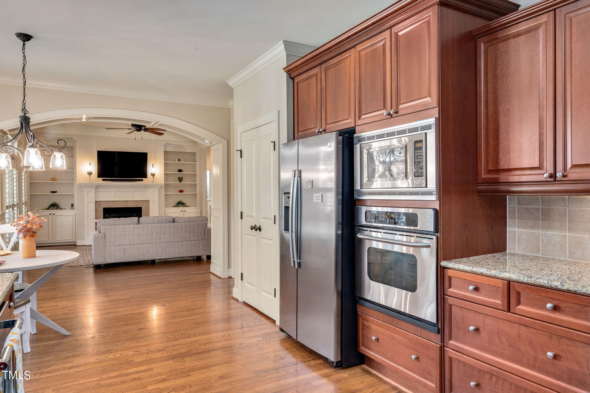 11519 Azari Court Raleigh, NC 27614 - Photo 20 of 55 a kitchen with stainless steel appliances granite countertop a refrigerator a stove and a wooden floors