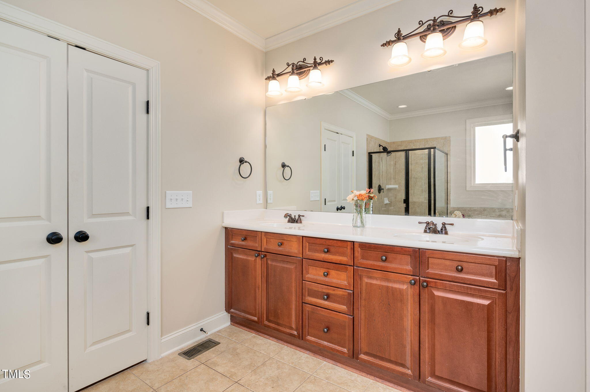 11519 Azari Court Raleigh, NC 27614 - Photo 25 of 55 a spacious bathroom with a double vanity sink a large mirror and shower