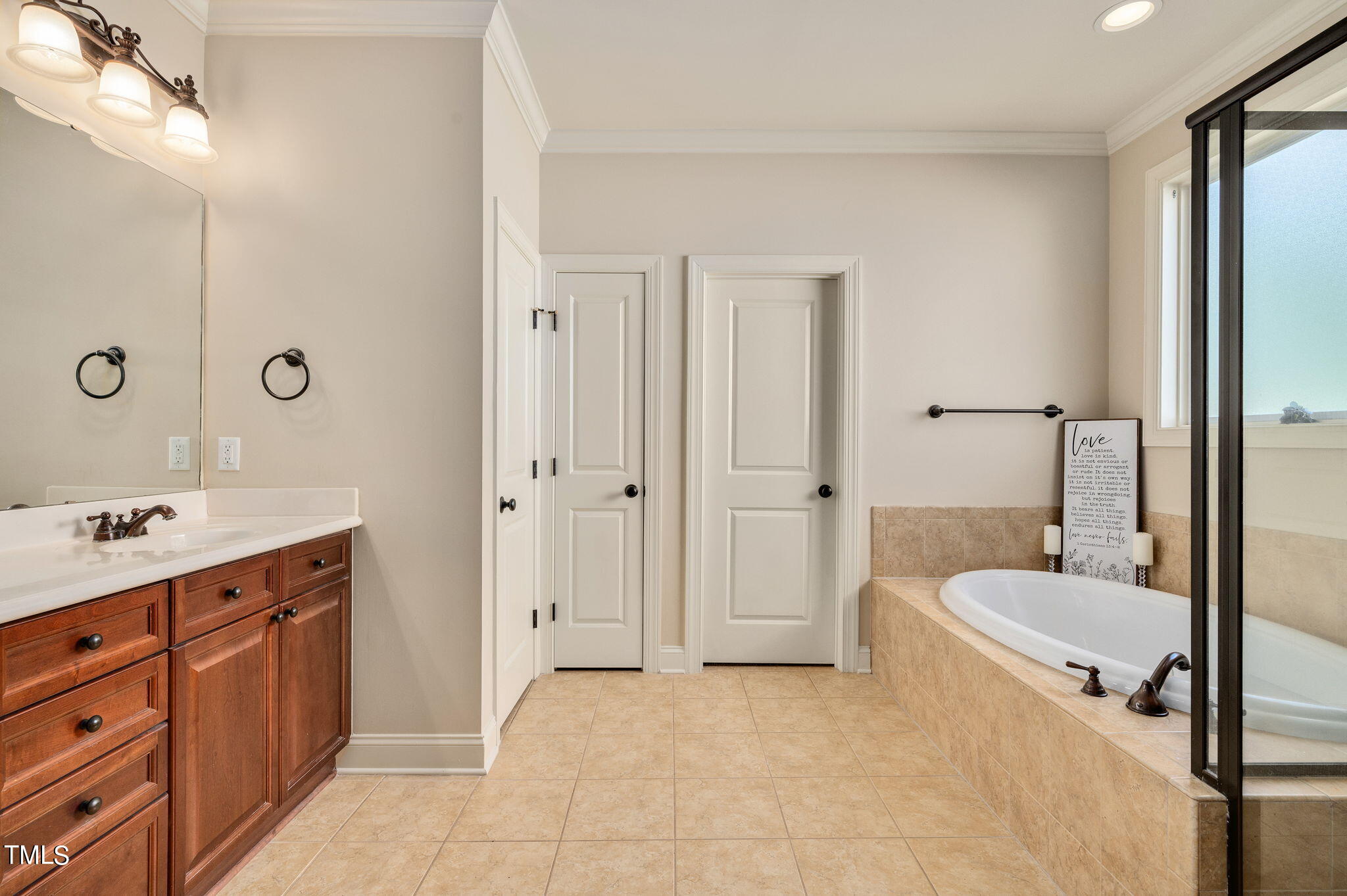 11519 Azari Court Raleigh, NC 27614 - Photo 27 of 55 a bathroom with a tub sink and mirror