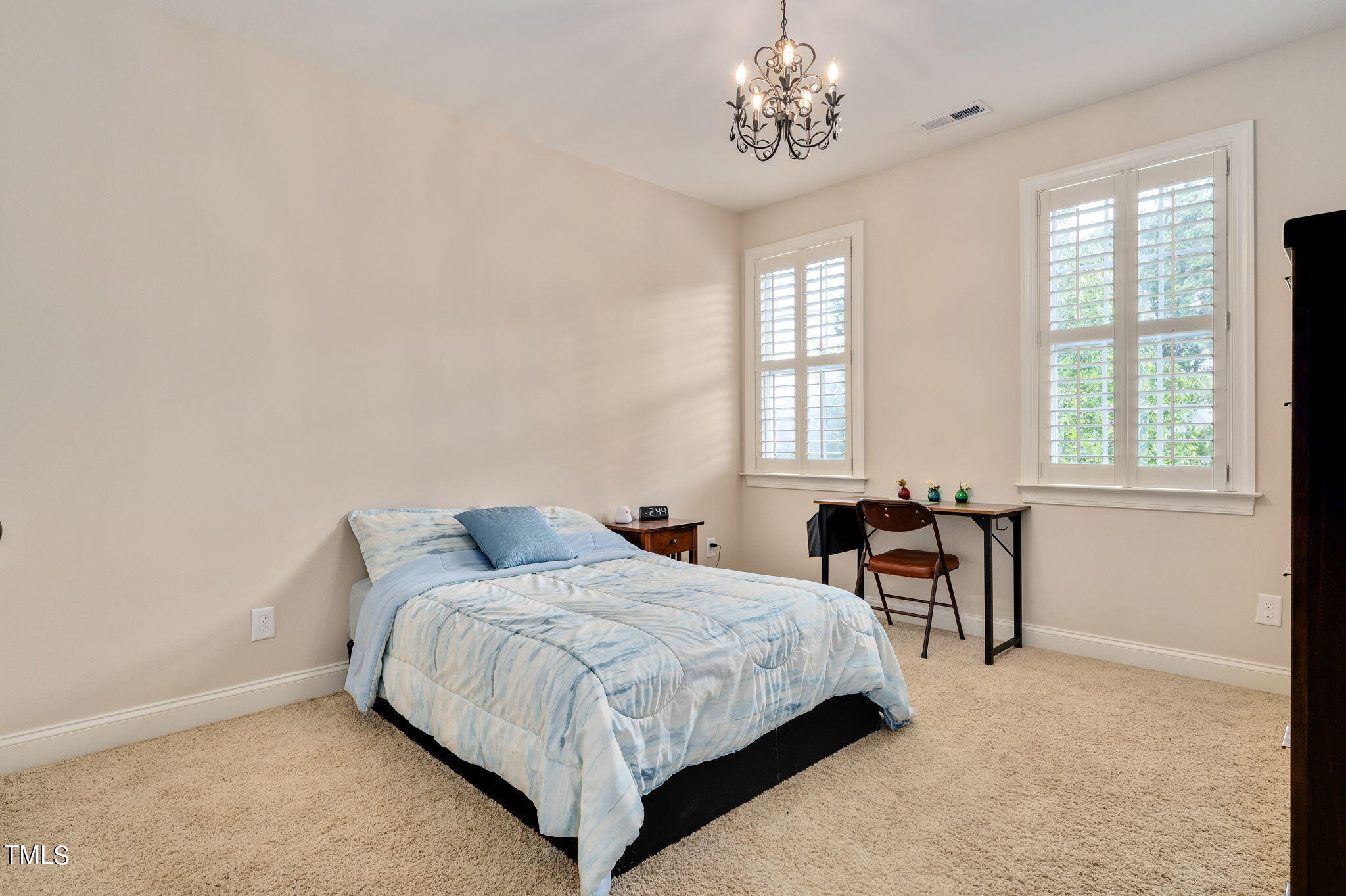 11519 Azari Court Raleigh, NC 27614 - Photo 28 of 55 a bedroom with a bed and a table