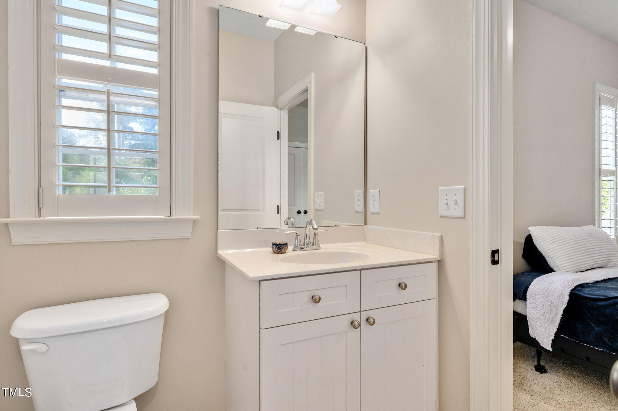 11519 Azari Court Raleigh, NC 27614 - Photo 38 of 55 a en suite bathroom with a toilet a sink and a mirror