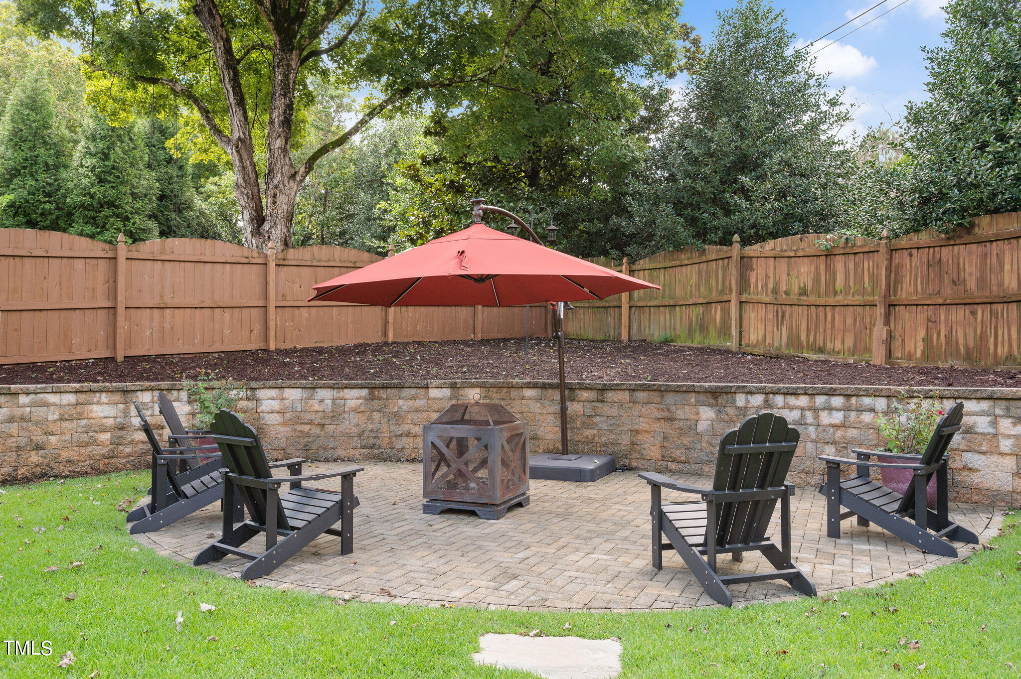 11519 Azari Court Raleigh, NC 27614 - Photo 50 of 55 a view of a chairs and table in backyard