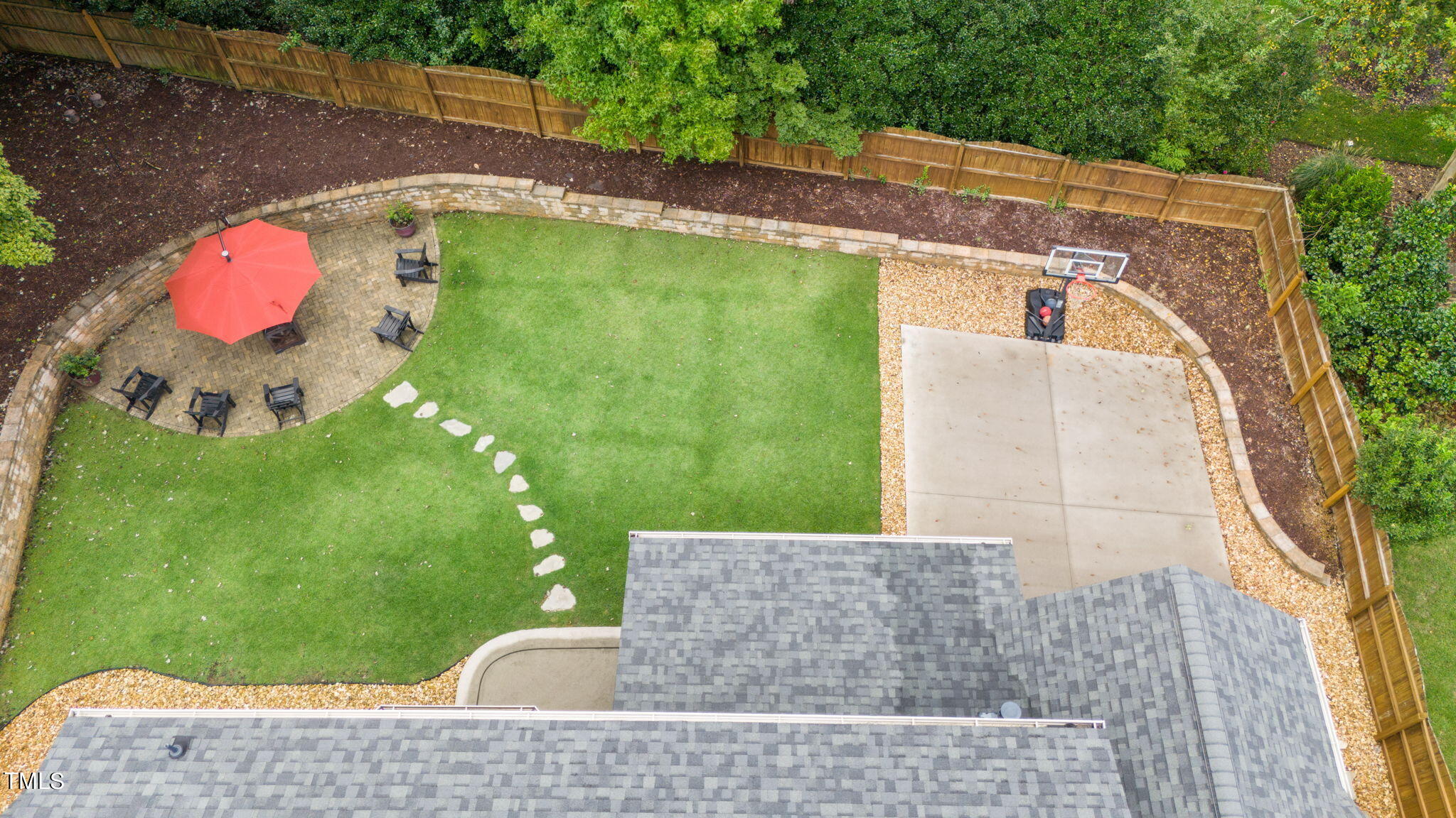 11519 Azari Court Raleigh, NC 27614 - Photo 52 of 55 a backyard of a house with table and chairs