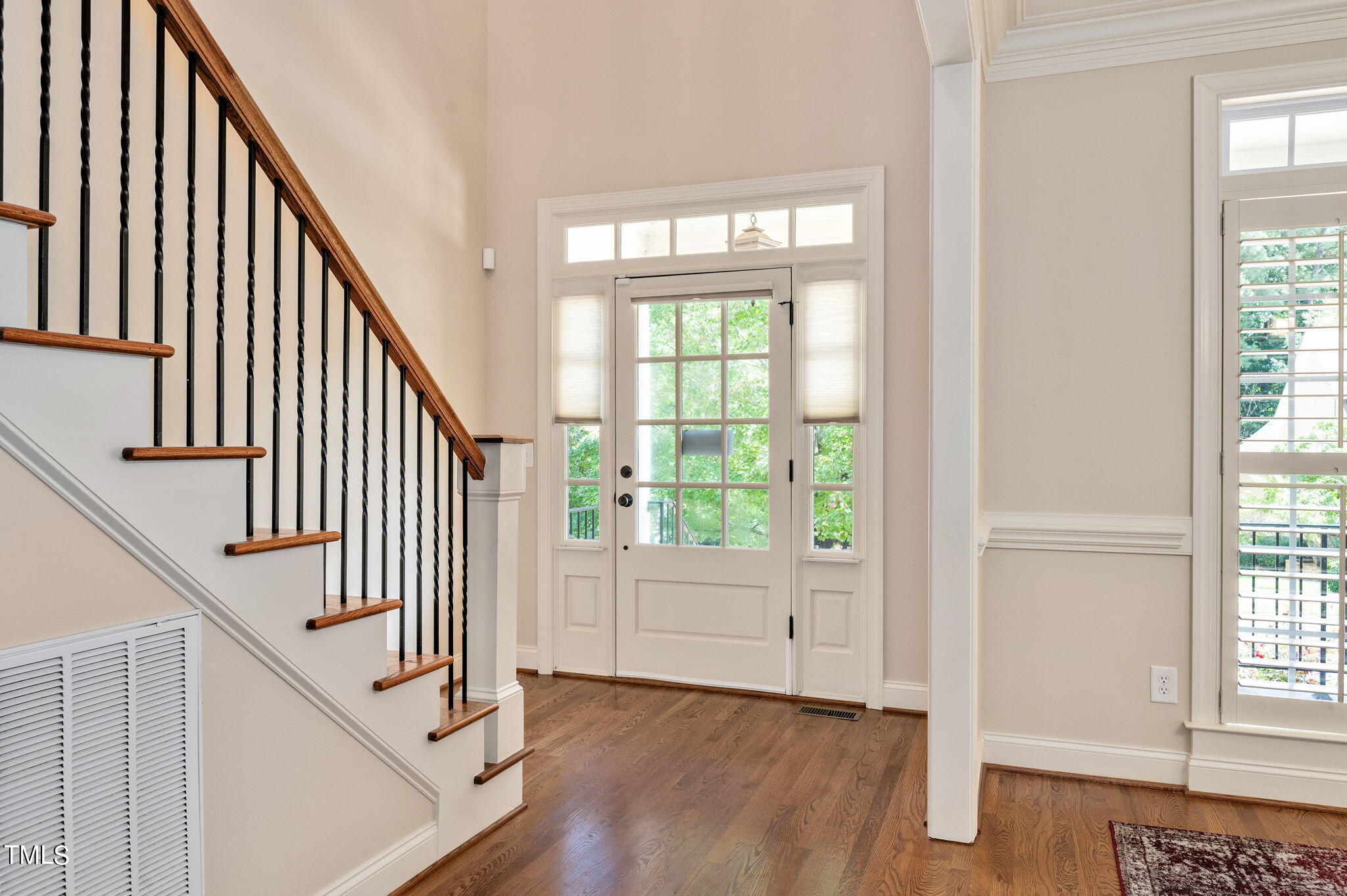 11519 Azari Court Raleigh, NC 27614 - Photo 6 of 55 an entryway with wooden floor and stairs