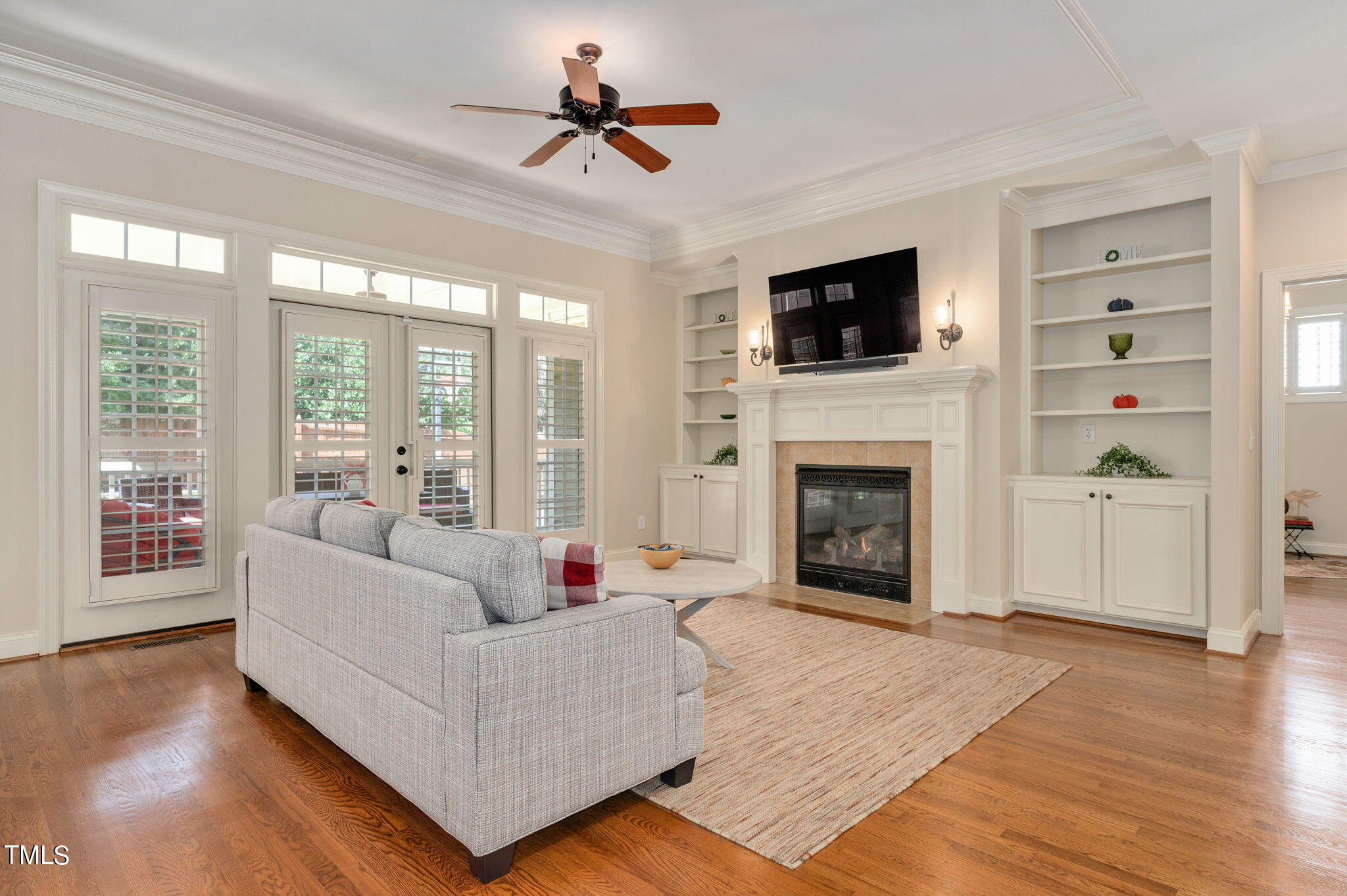 11519 Azari Court Raleigh, NC 27614 - Photo 10 of 55 a living room with furniture a flat screen tv and a fireplace