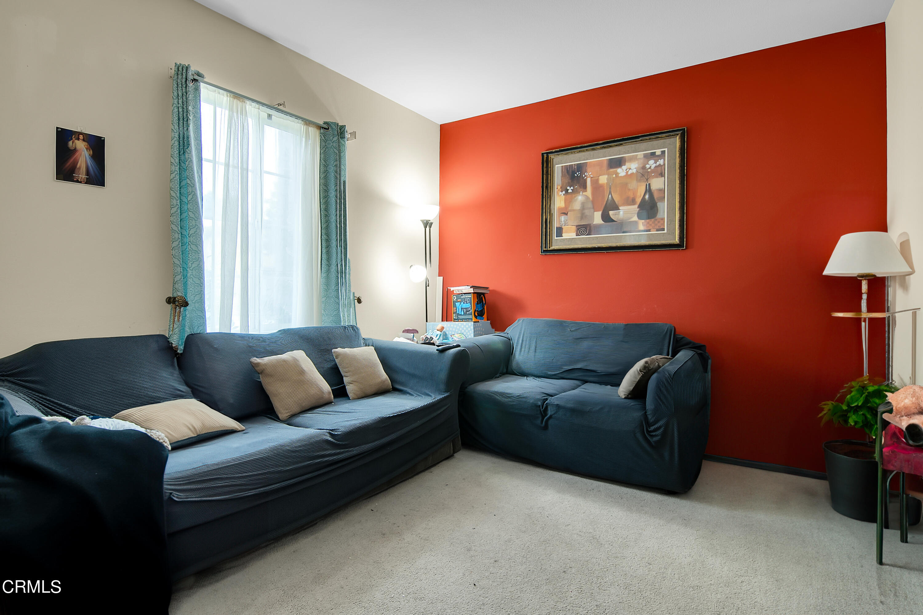 1611 Sonata Drive Oxnard, CA 93030 - Photo 12 of 25 a living room with furniture and a potted plant