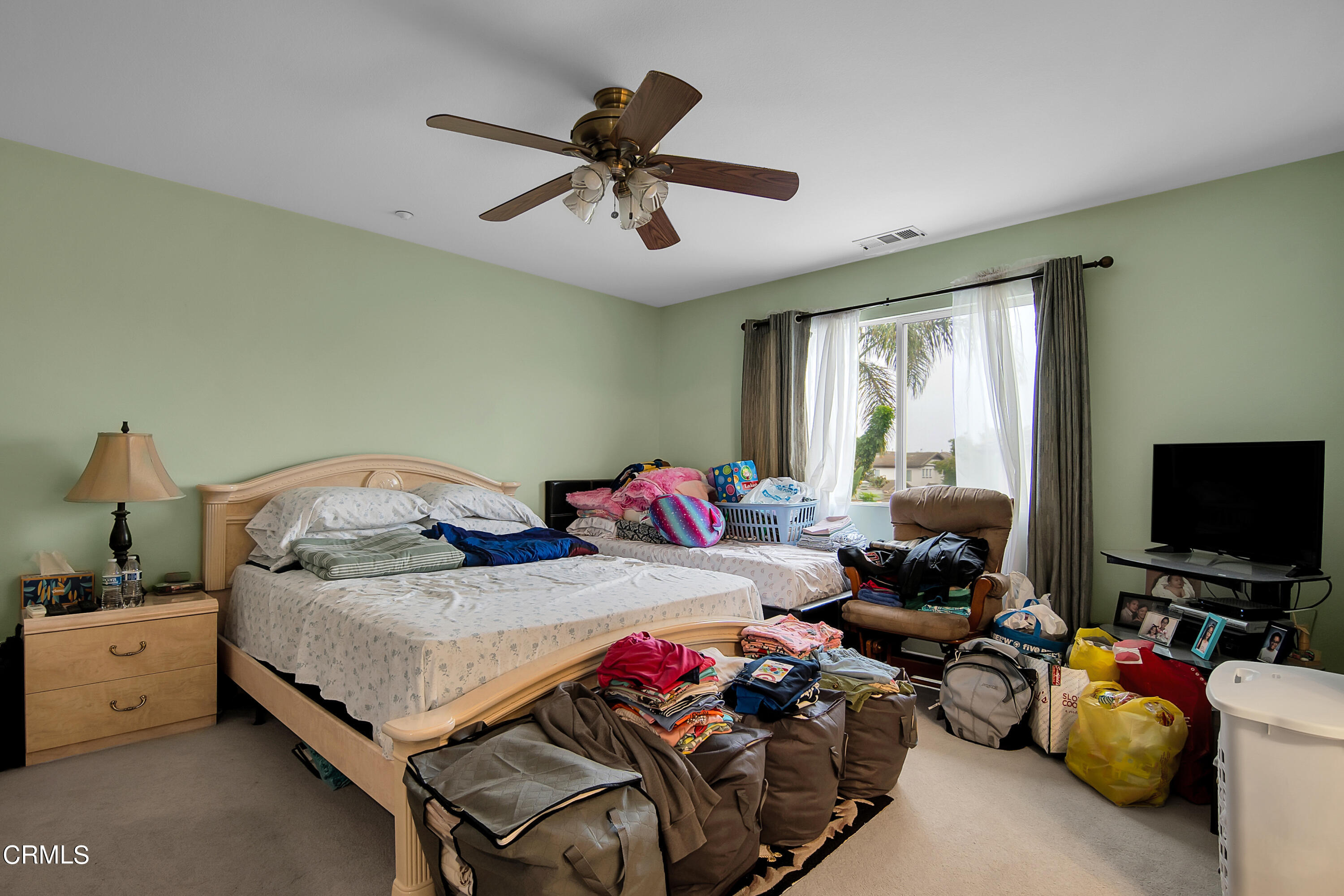 1611 Sonata Drive Oxnard, CA 93030 - Photo 15 of 25 a bedroom with bed and a flat screen tv