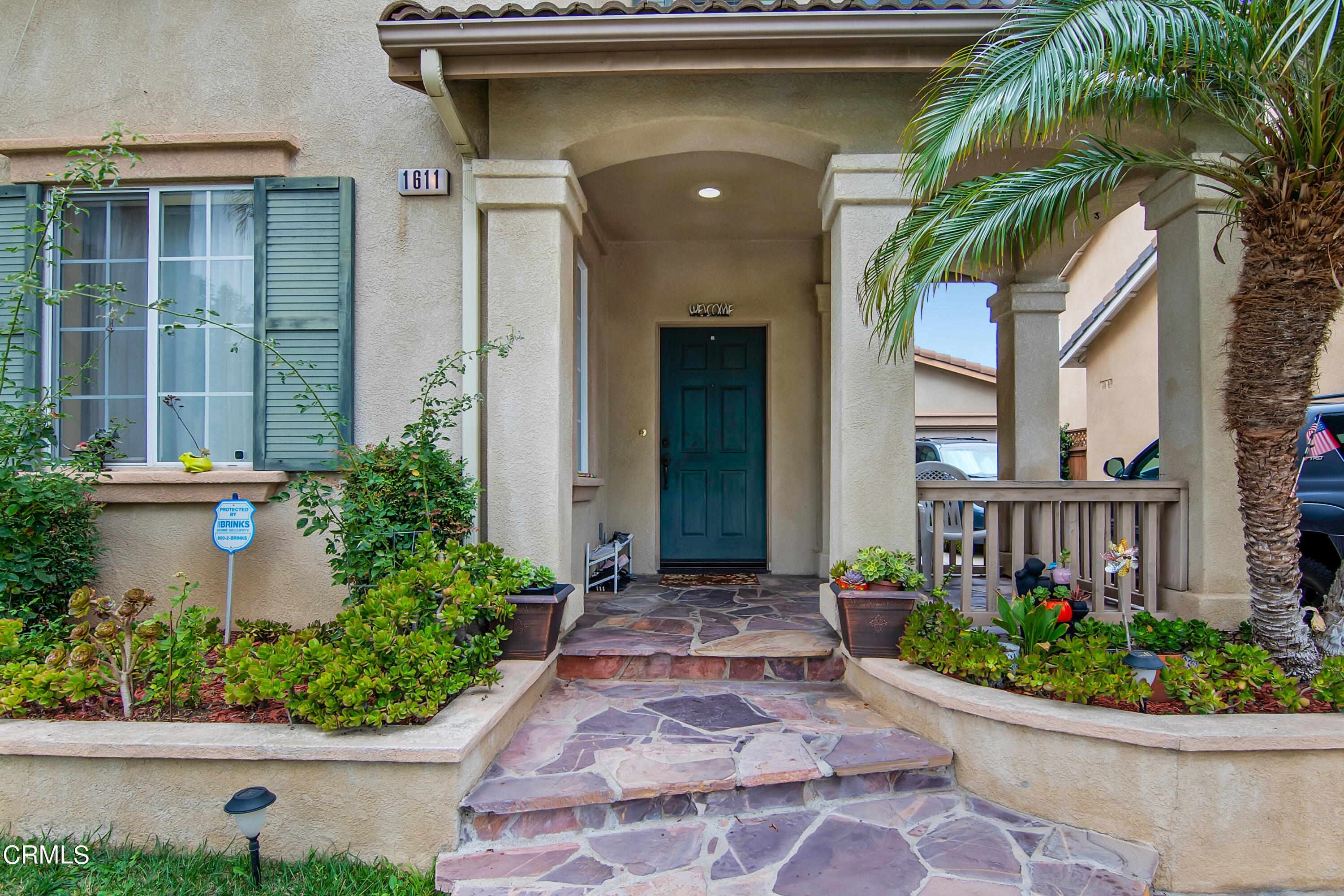1611 Sonata Drive Oxnard, CA 93030 - Photo 2 of 25 a front view of a house with a yard