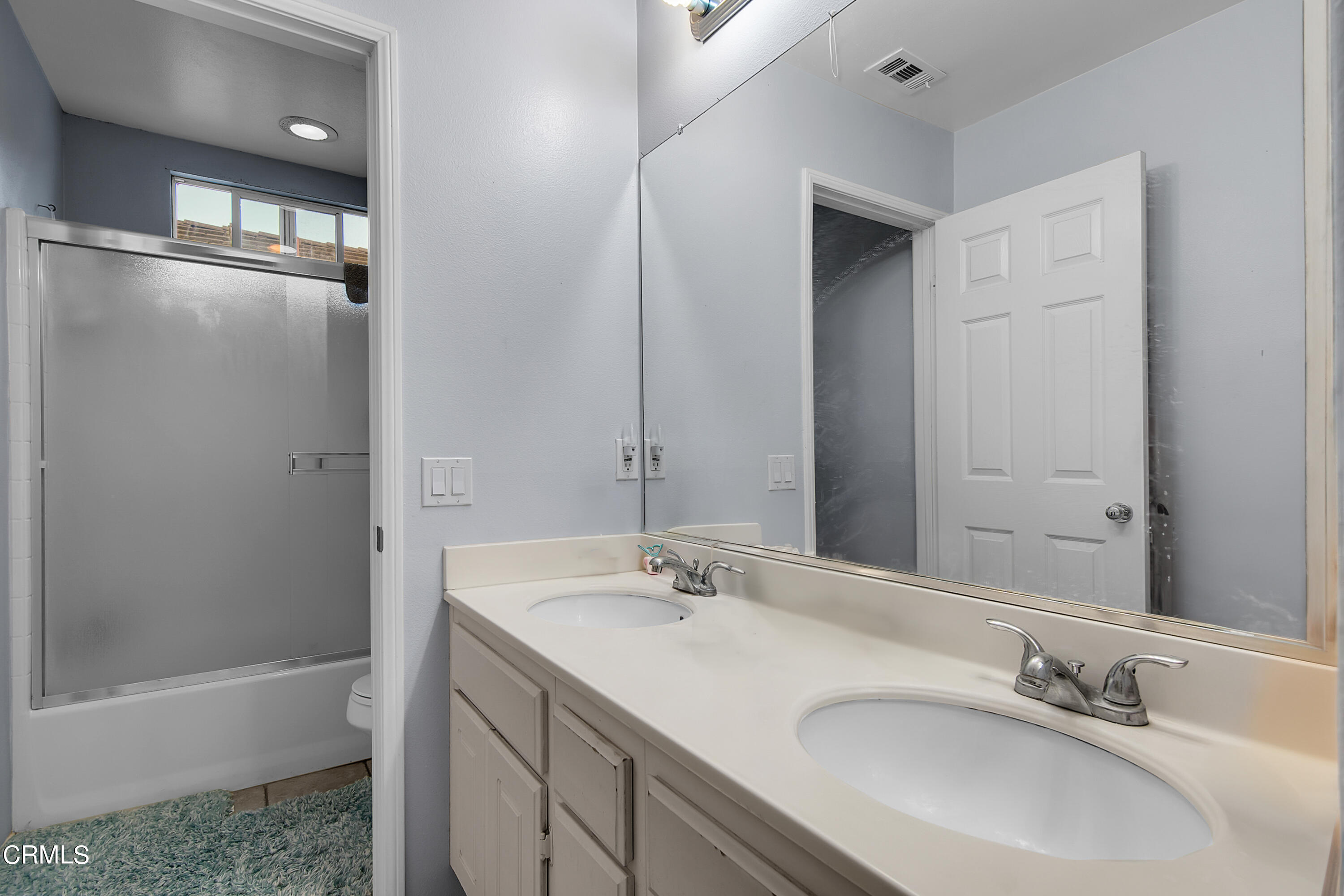 1611 Sonata Drive Oxnard, CA 93030 - Photo 22 of 25 a bathroom with a sink double vanity and a bathtub