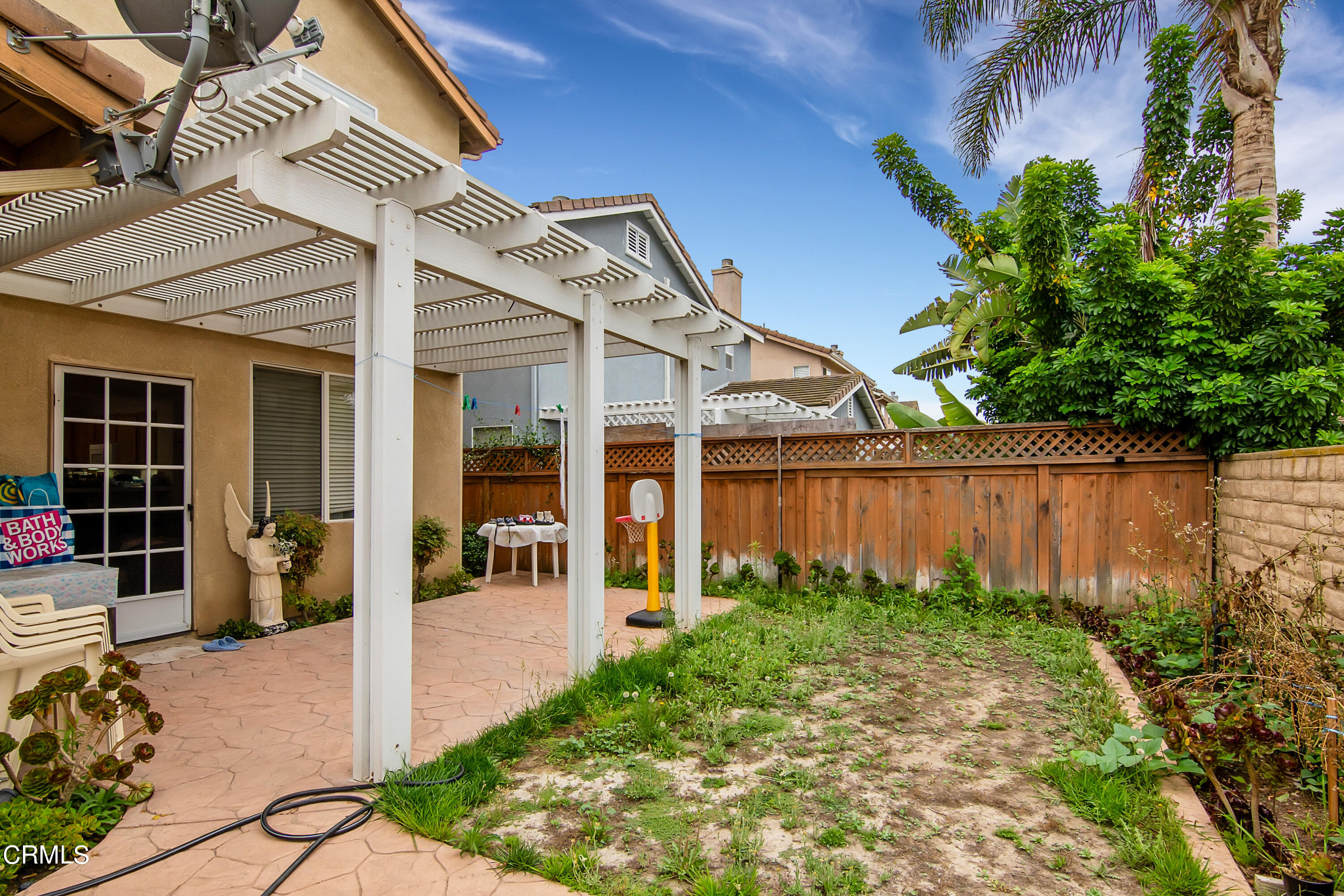 1611 Sonata Drive Oxnard, CA 93030 - Photo 24 of 25 a front view of a house with garden