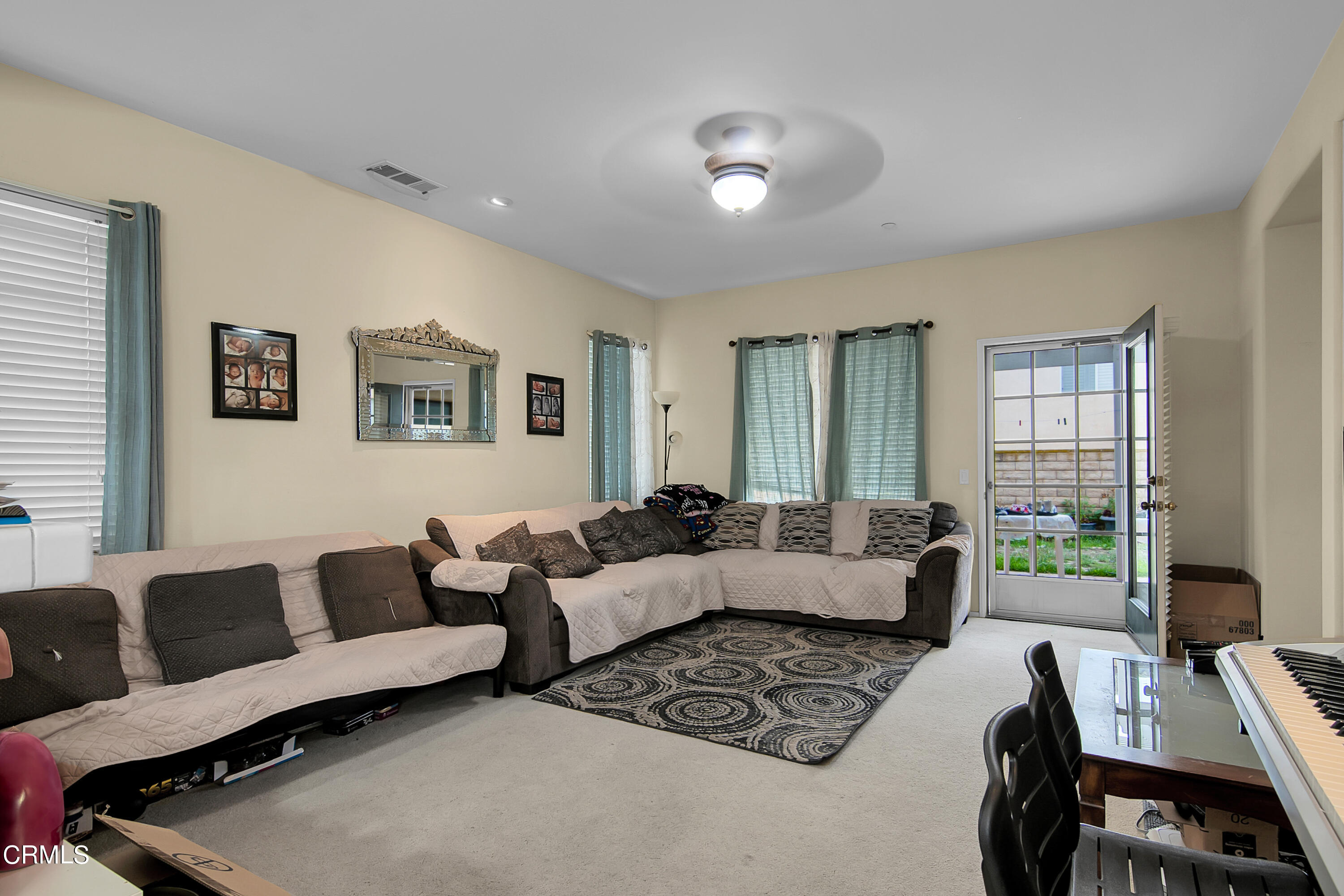 1611 Sonata Drive Oxnard, CA 93030 - Photo 7 of 25 a living room with furniture and a window