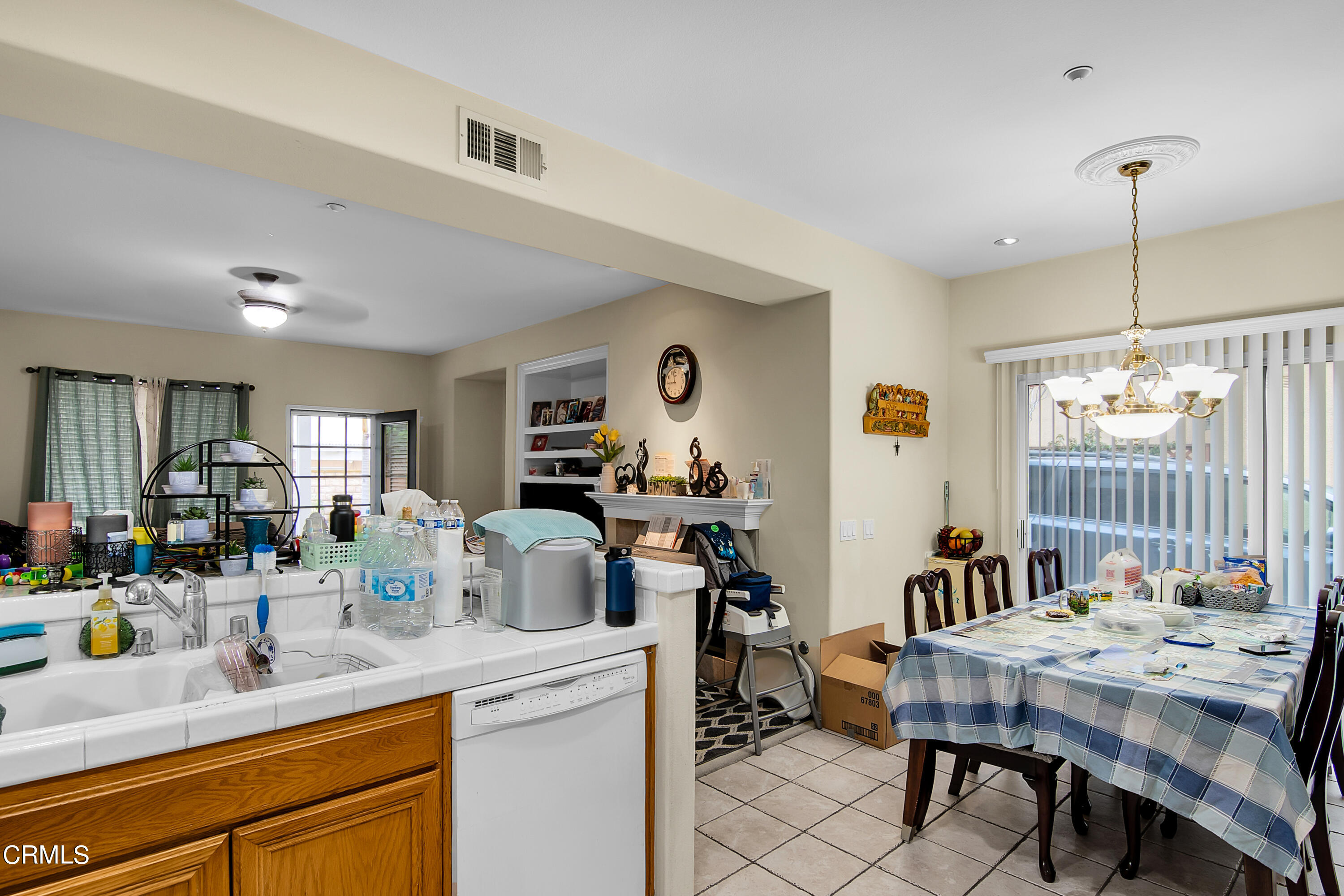 1611 Sonata Drive Oxnard, CA 93030 - Photo 9 of 25 a view of a kitchen area with furniture and window