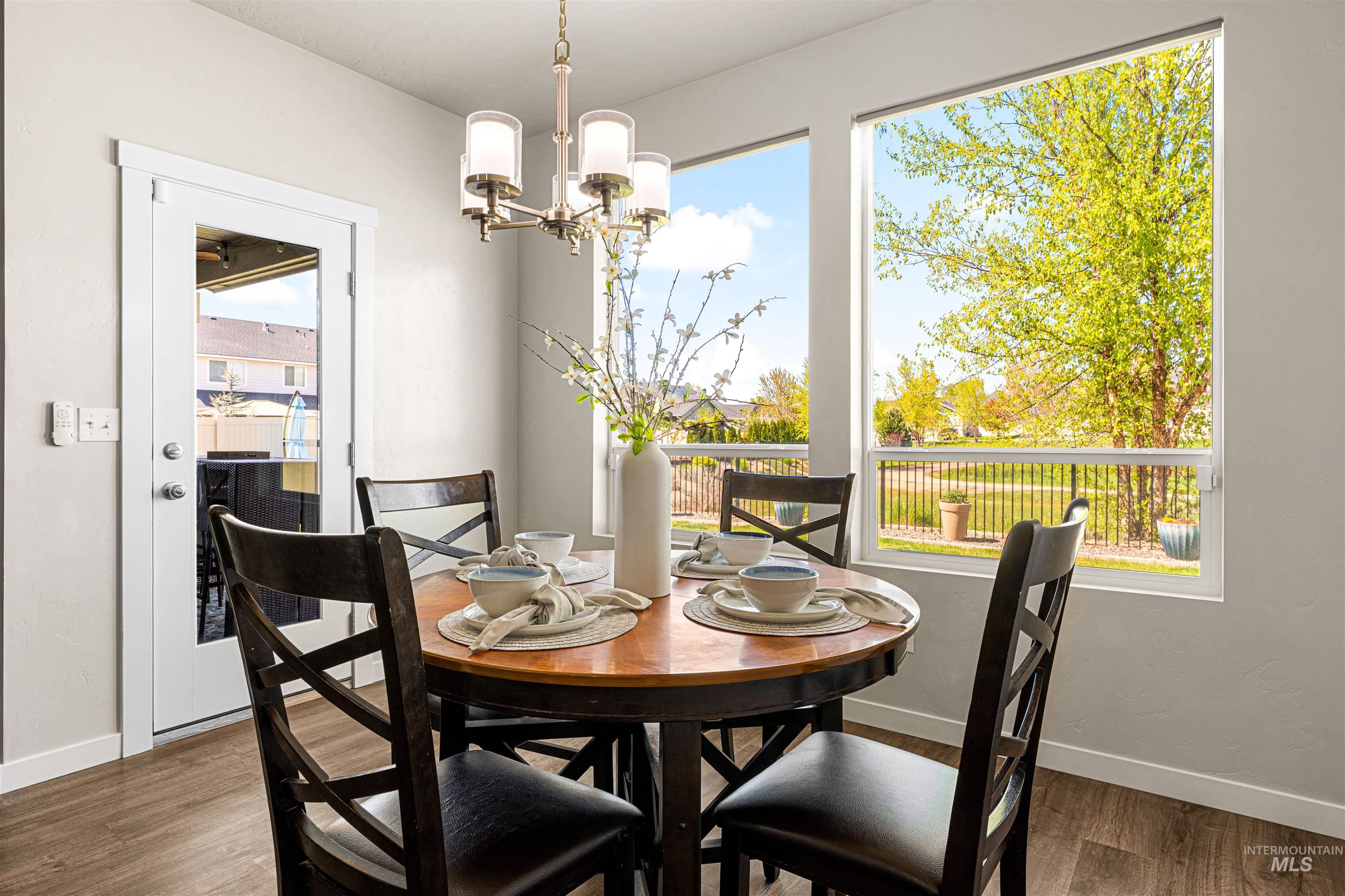 10890 West Sharpthorn Street Boise, ID 83709 - Photo 19 of 50 Dining area featuring wood-finish flooring and light gray walls