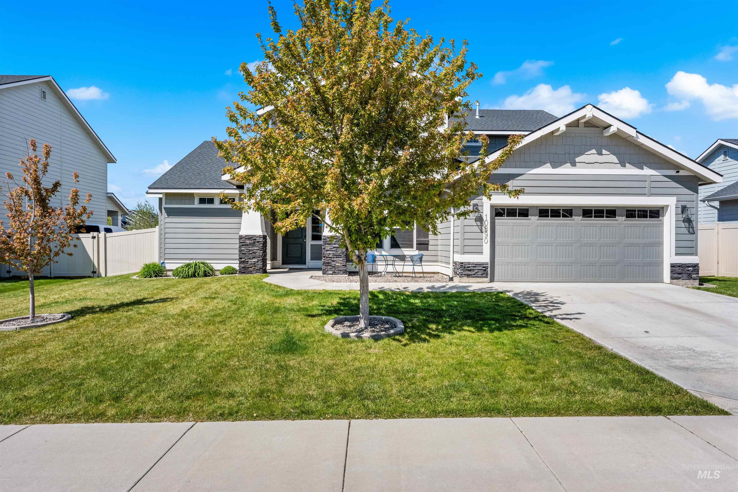 10890 West Sharpthorn Street Boise, ID 83709 - Photo 2 of 50 Contemporary gray siding exterior with stone accents and a covered entry