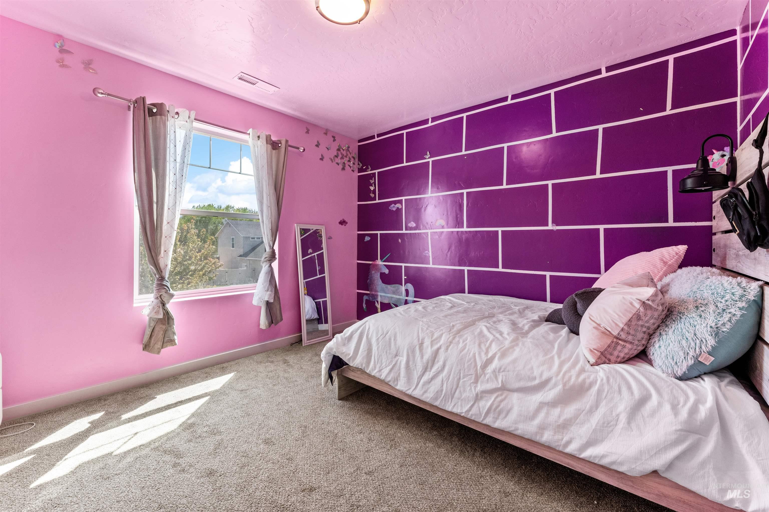10890 West Sharpthorn Street Boise, ID 83709 - Photo 35 of 50 Bright room featuring a large window with white trim, light gray carpet, and a white ceiling