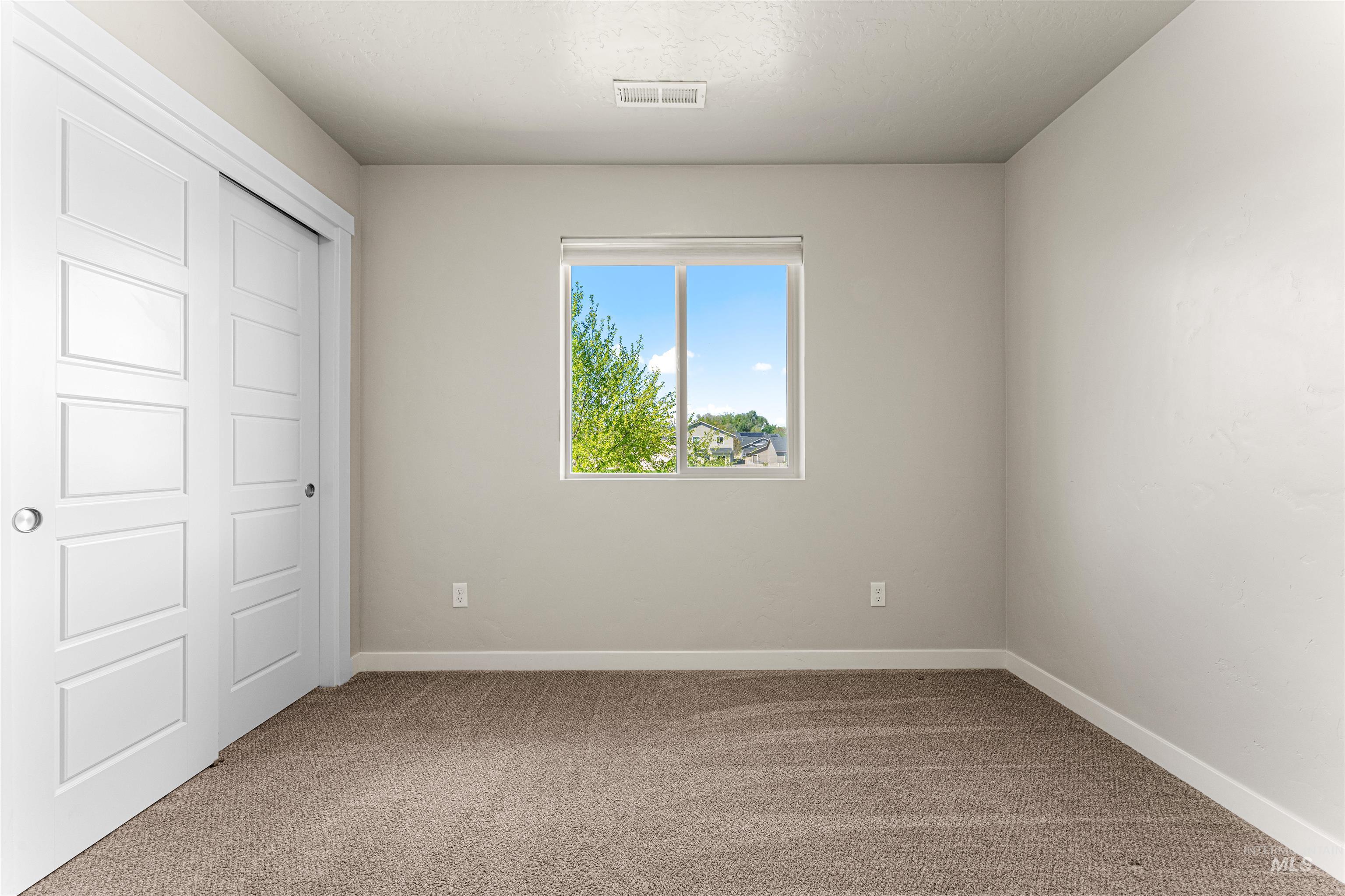 10890 West Sharpthorn Street Boise, ID 83709 - Photo 40 of 50 Neutral-toned carpeting complements light gray wall finishes