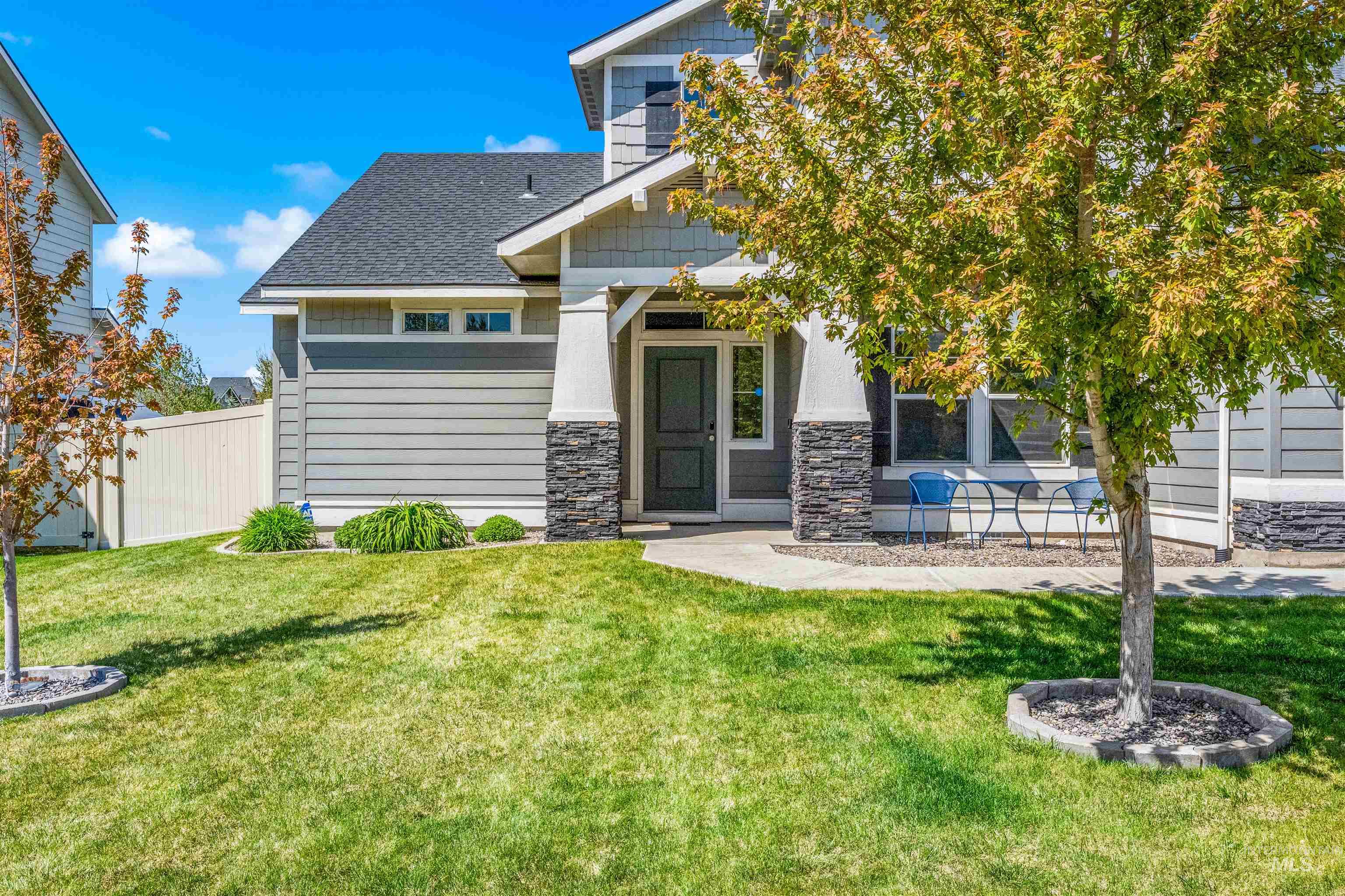 10890 West Sharpthorn Street Boise, ID 83709 - Photo 4 of 50 Contemporary exterior with gray horizontal siding and stacked stone accents