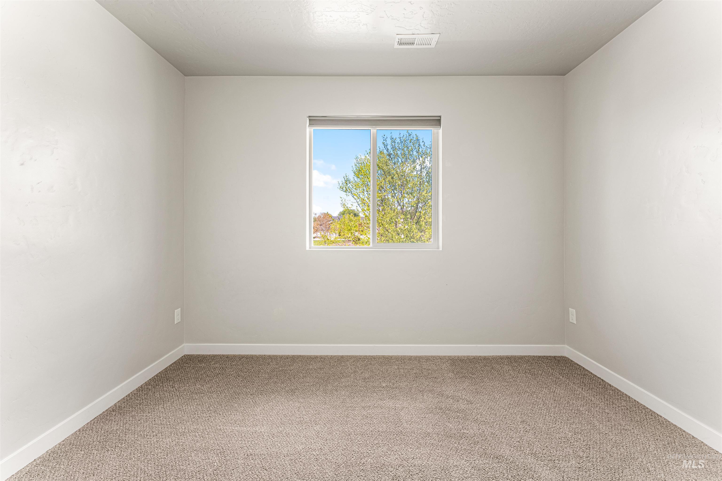 10890 West Sharpthorn Street Boise, ID 83709 - Photo 41 of 50 Room featuring light neutral wall paint, a single window, a textured ceiling, a carpeted floor, and white trim
