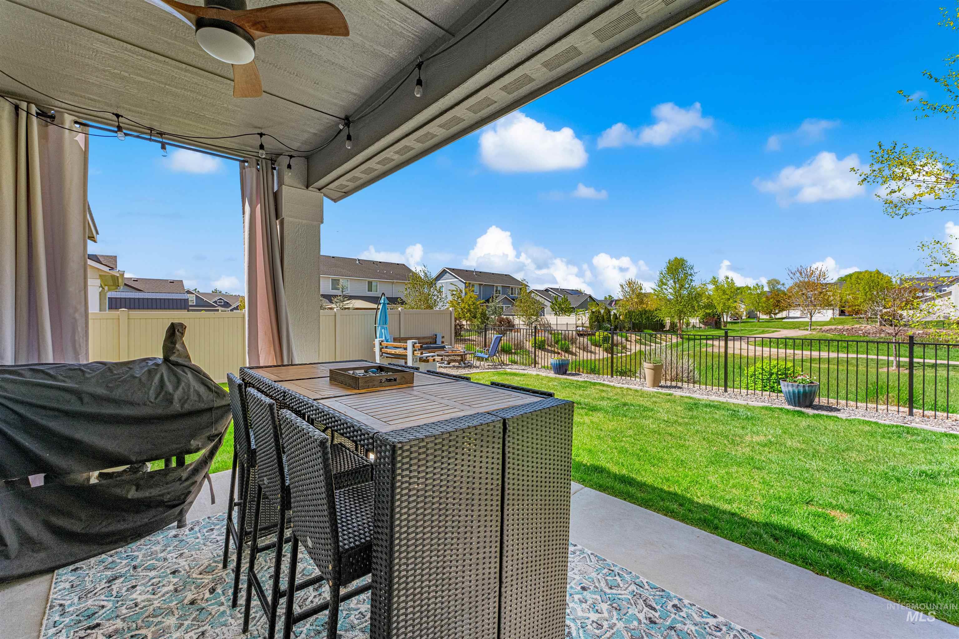 10890 West Sharpthorn Street Boise, ID 83709 - Photo 42 of 50 Covered patio featuring a ceiling fan with integrated lighting, string lights, and concrete flooring