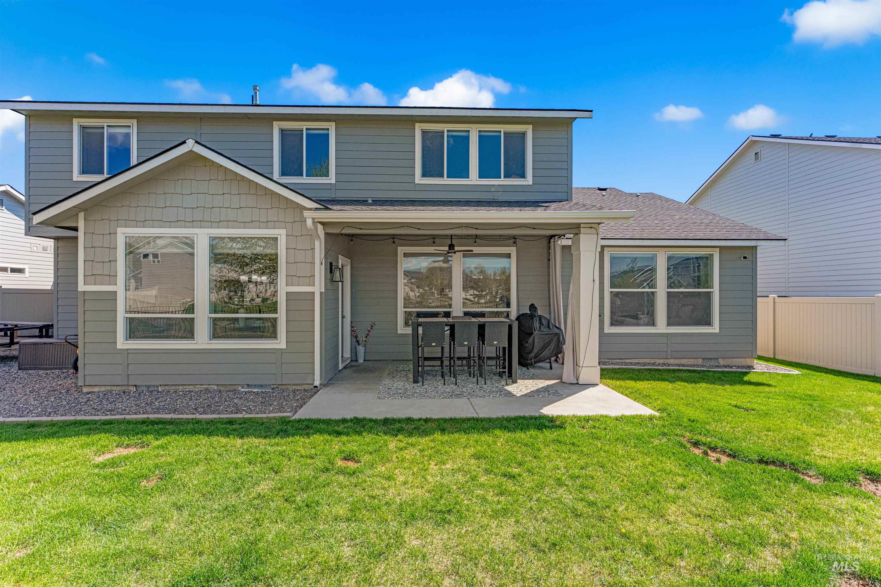 10890 West Sharpthorn Street Boise, ID 83709 - Photo 47 of 50 Expansive backyard with a lush green lawn