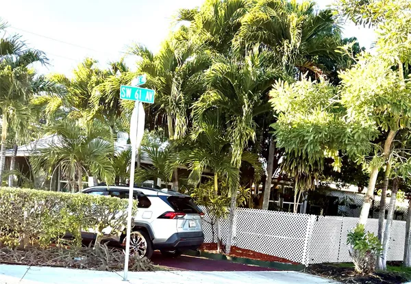a view of yard with cars parked