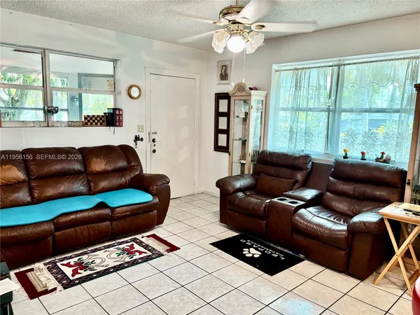 a living room with furniture and a window