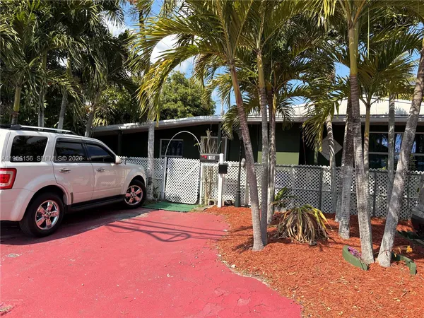 a view of a yard with car parked