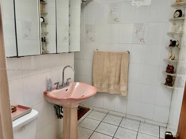 a bathroom with a sink and toilet