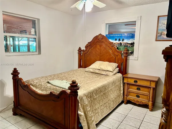 a view of a porch with furniture and floor to ceiling window