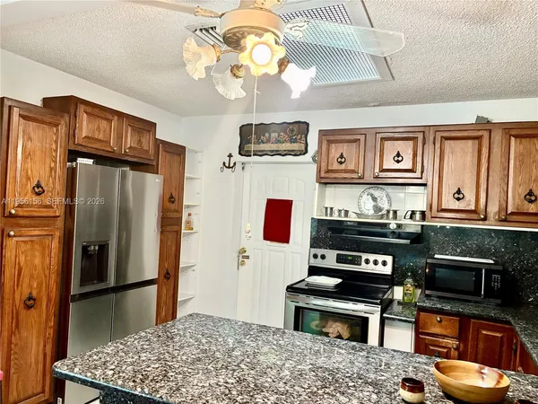 a front view of a house with outdoor seating