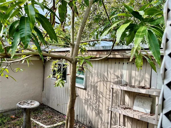 a view of balcony and chairs with wooden floor