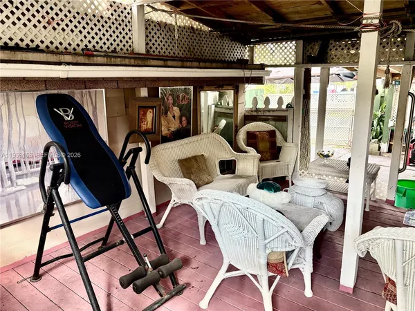 a view of a patio with table and chairs