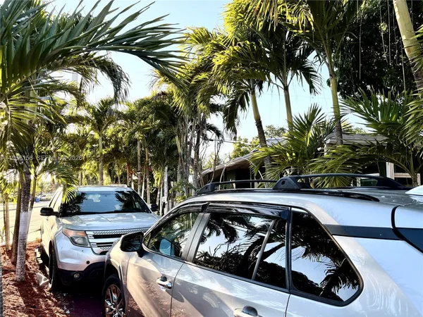 a view of a car parked on the street