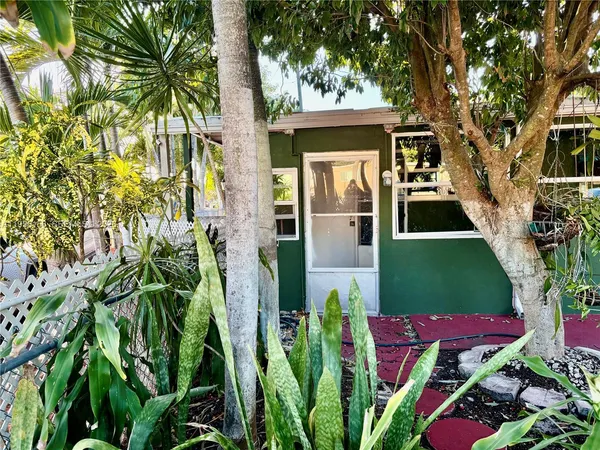 a front view of a house with yard